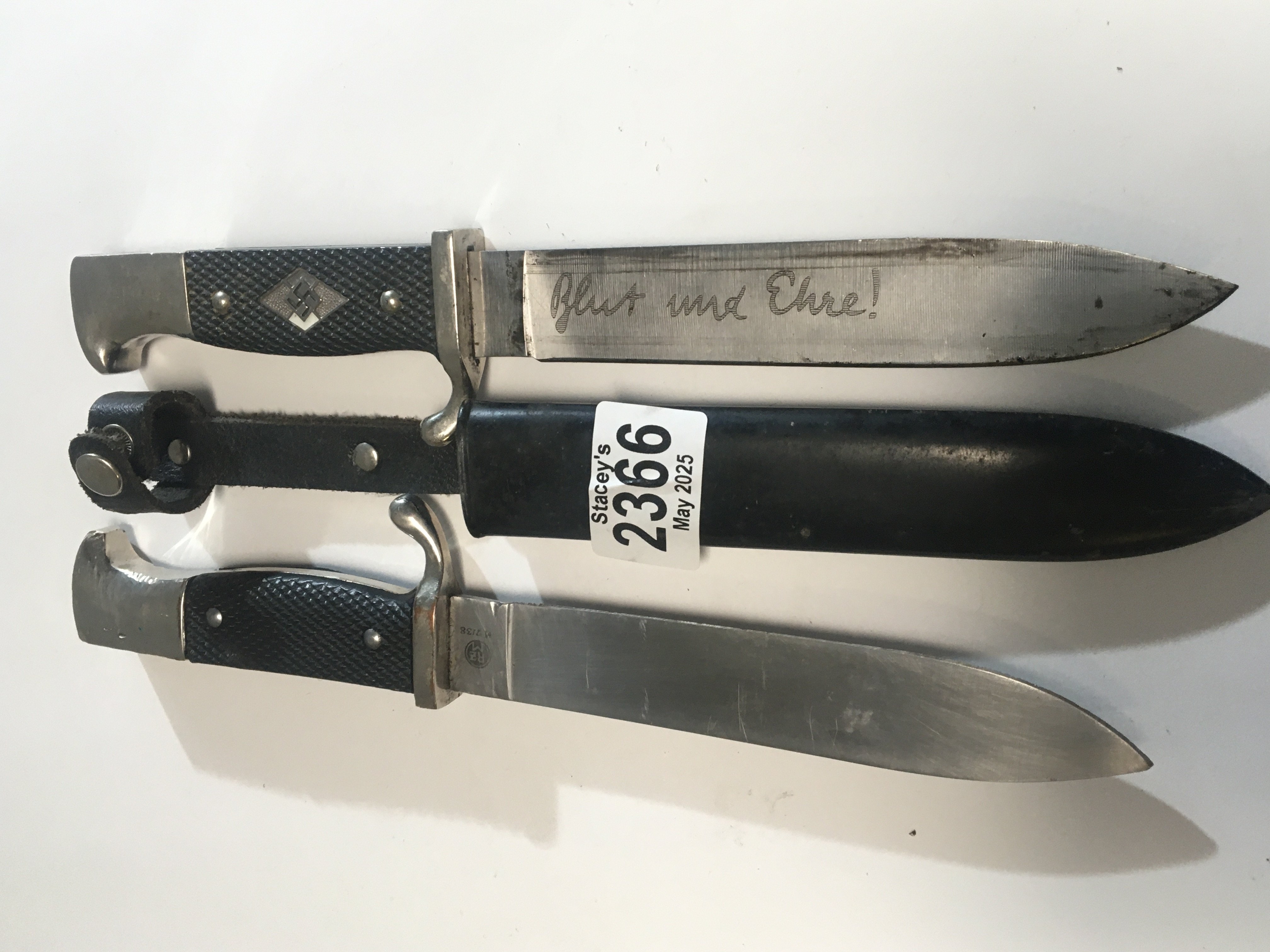 Two German Third Reich Hitler Youth Knifes both with engraved blades one without scabbard with RZ makers marks and serial number (2)