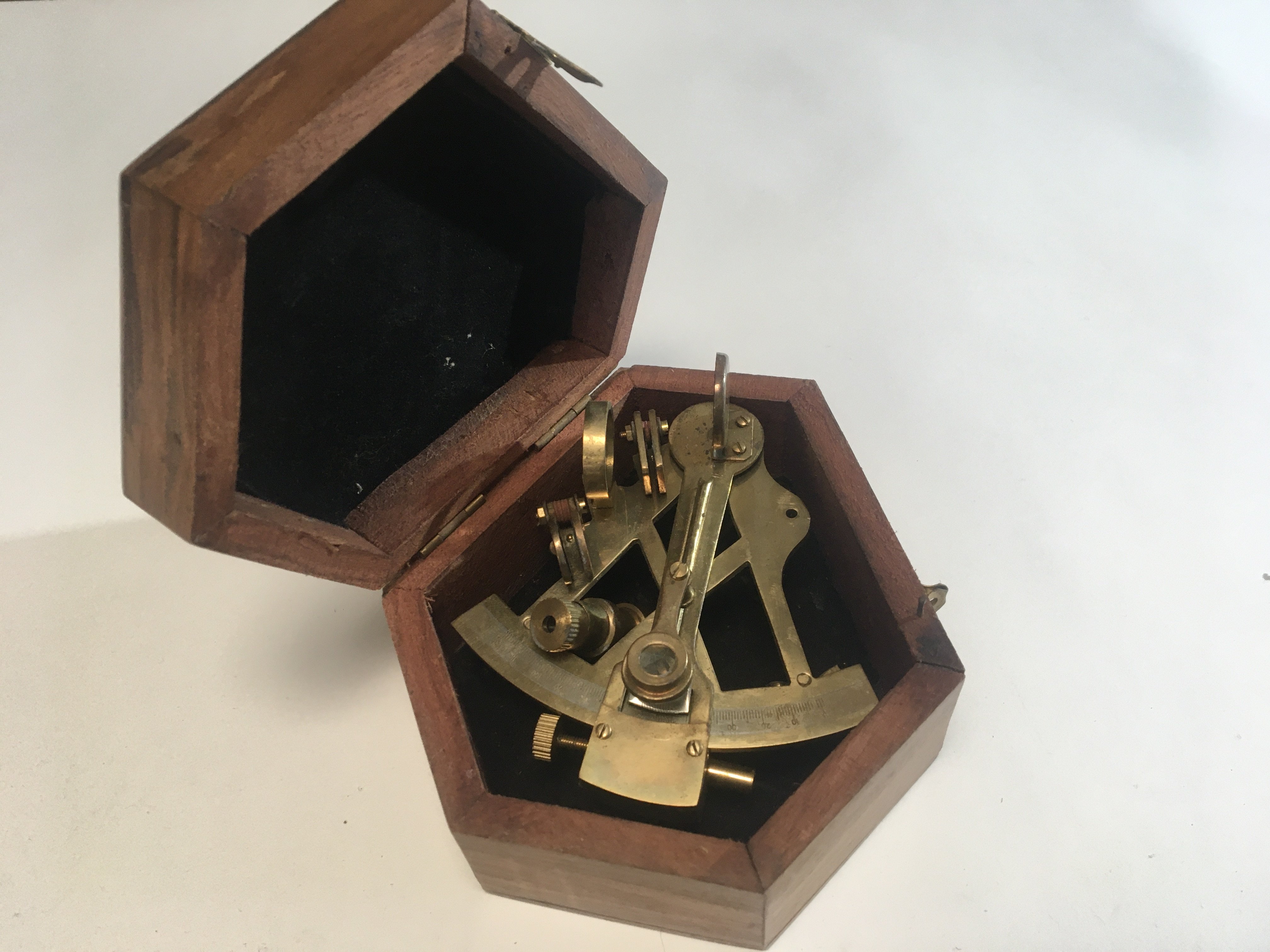 A reproduction navy brass sextant in a fitted box.