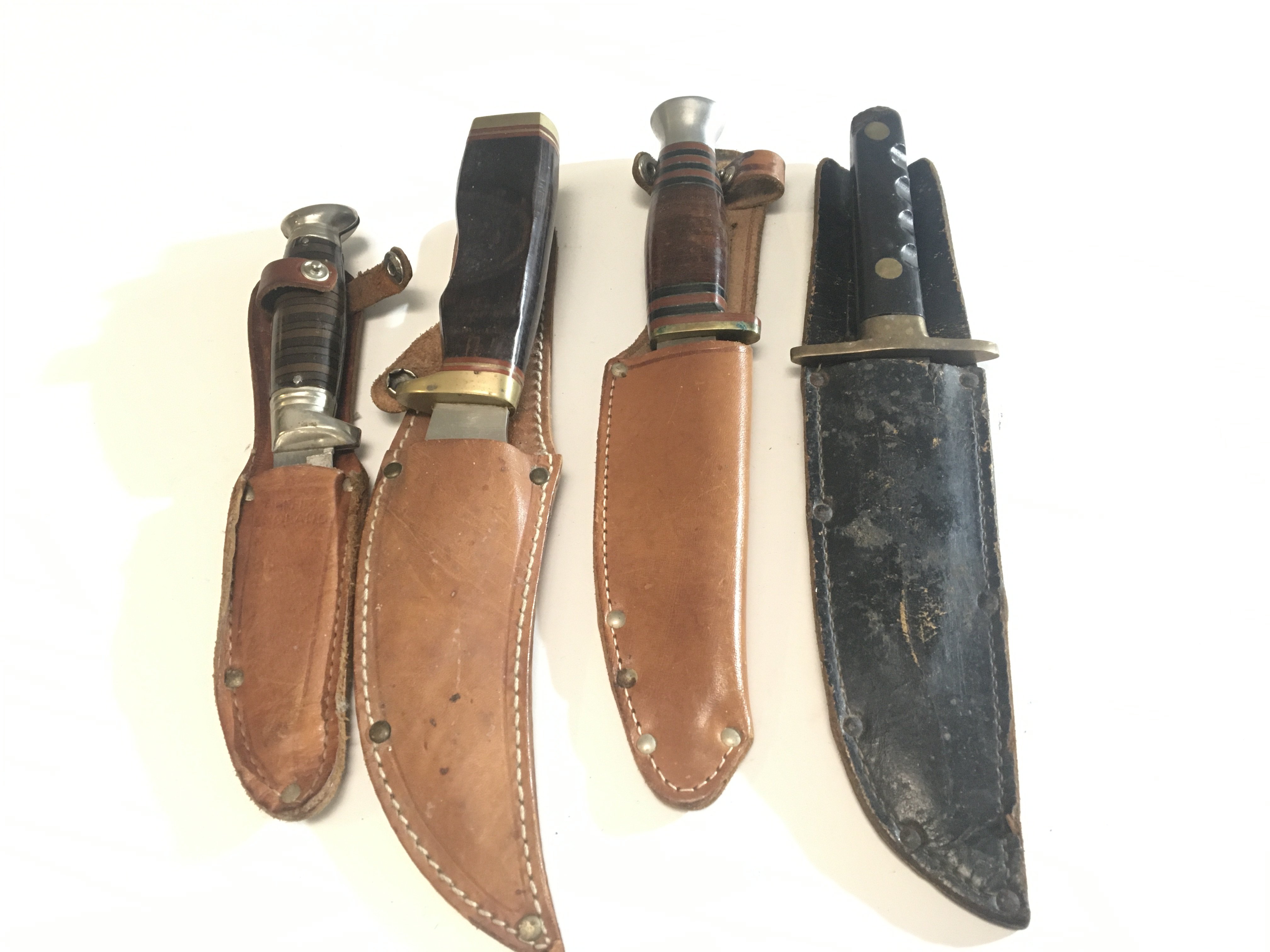 A collection of four Vintage Hunting Knifes Joseph Rodgers Sheffield Richards Sheffield and two others (4)