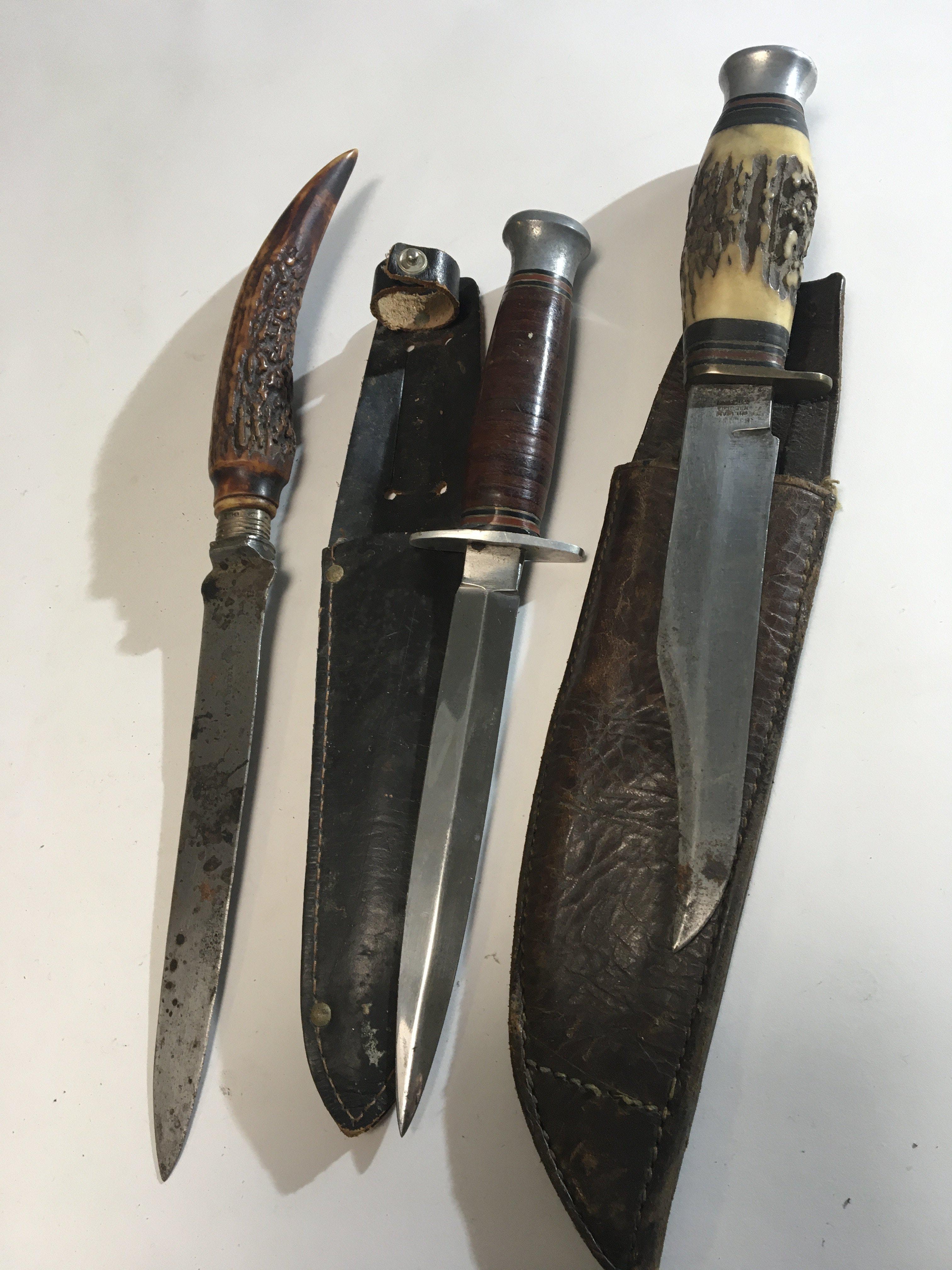 Three Vintage knifes made in Sheffield two with horn handles some obscure makers marks (3)