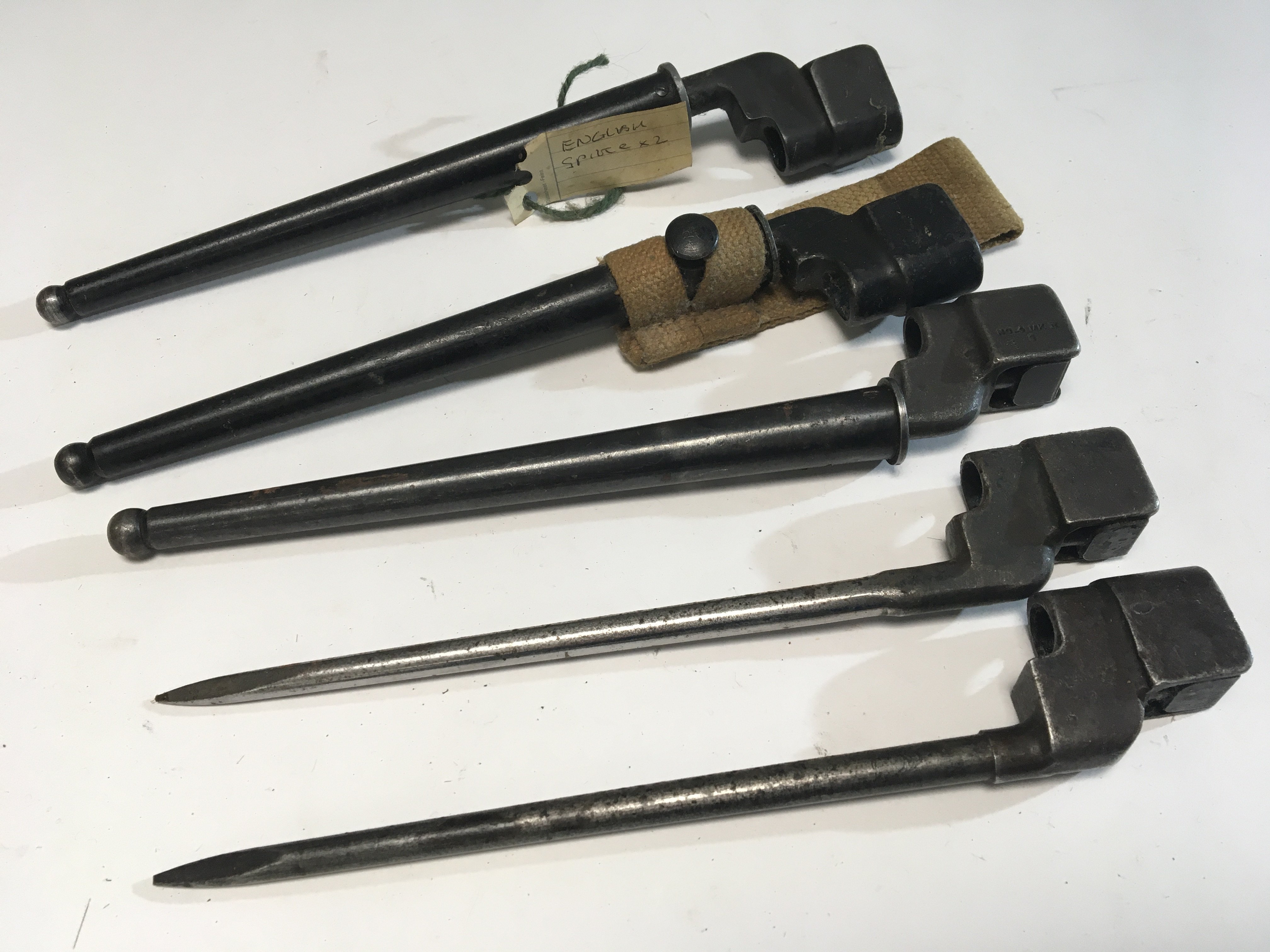 A collection of five of British Military issue Spike bayonets most with serial numbers three with steel scabbards (5)