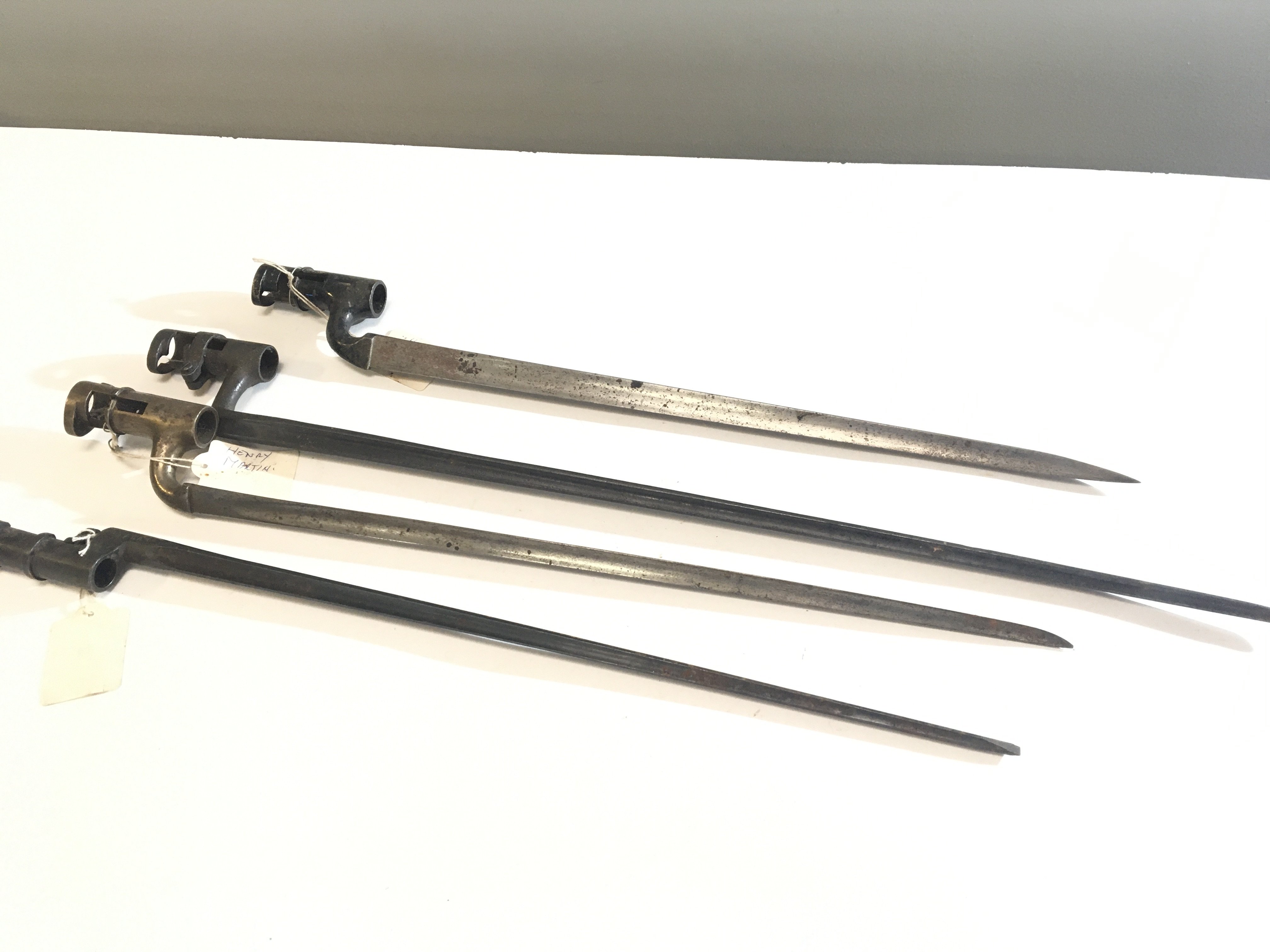 A collection of four long steel spike bayonets British 19th century issue with fixed sockets and possibly Russian (4)