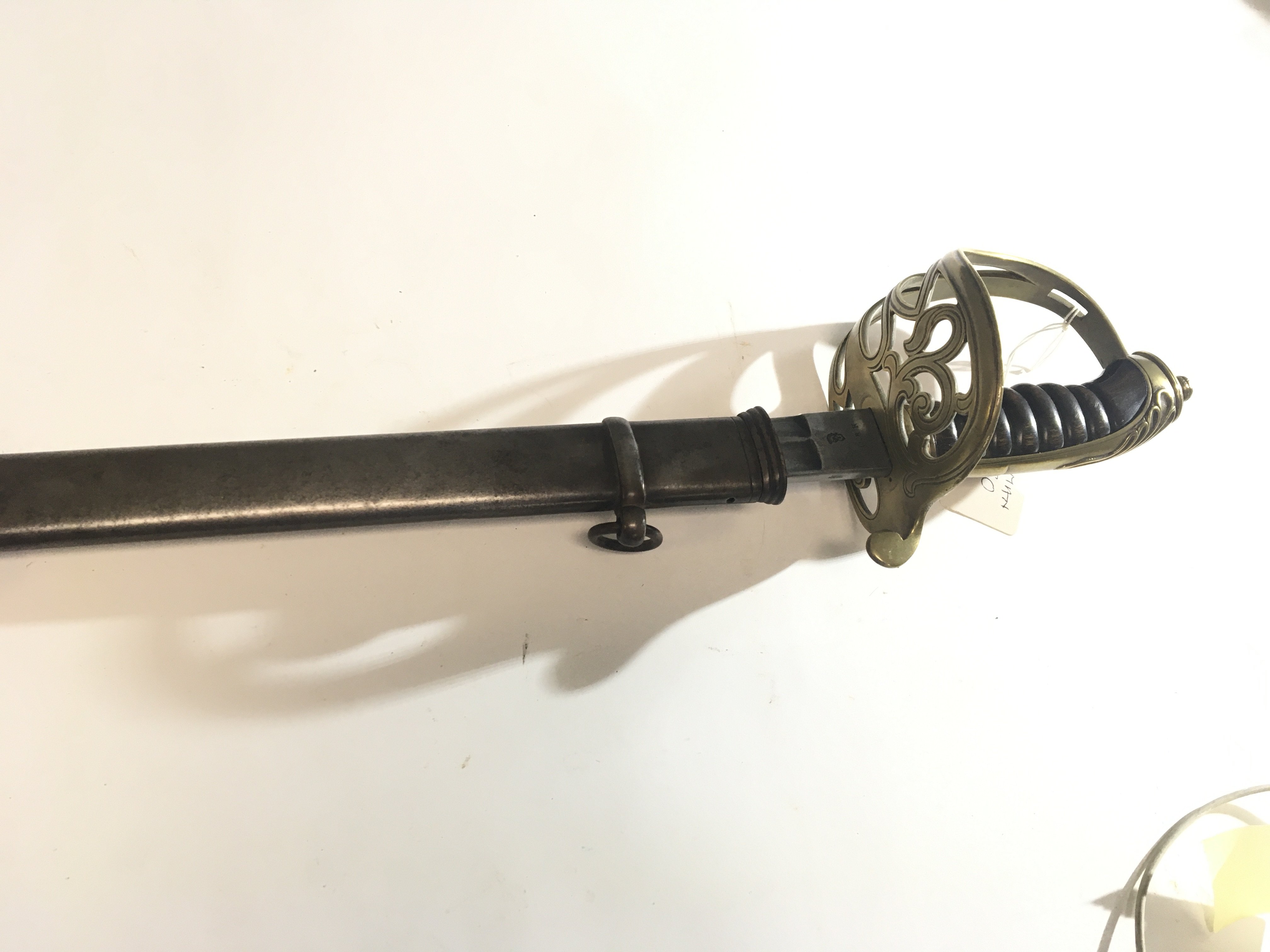 A German Imperial Sword possible 1890 Leopold III with brass Guard wood grip the blade stamped WRK with steel scabbard