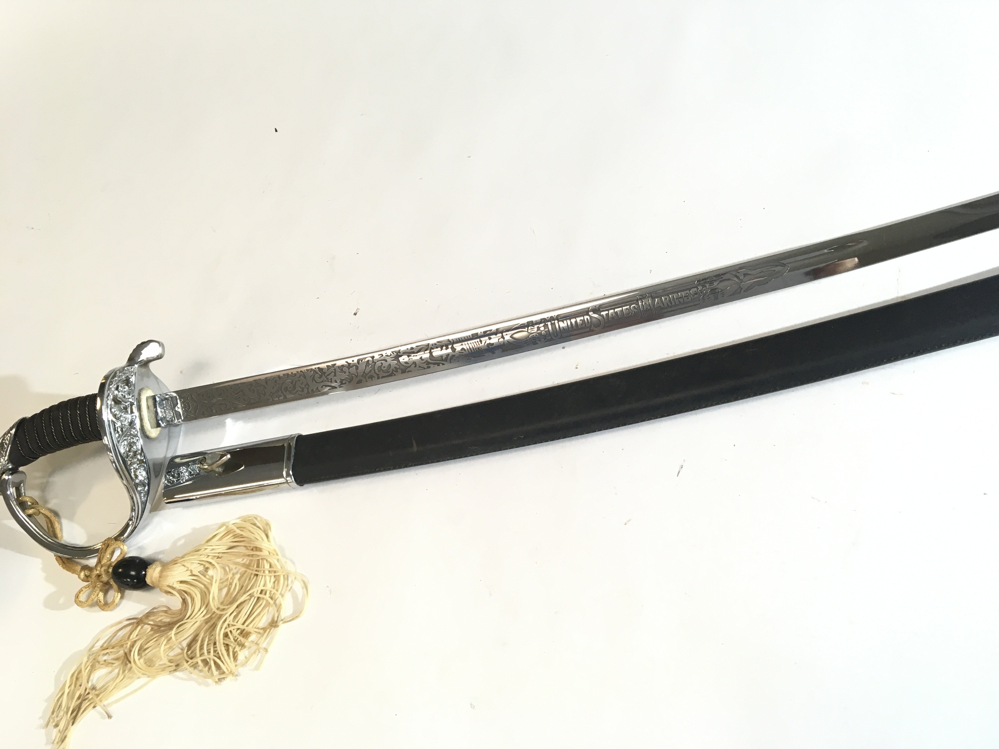 A 20th Century chrome finish cavalry sword a Quality retrospective collectors copy An American Cavalry sword with elaborate blade engraved United States Marines.