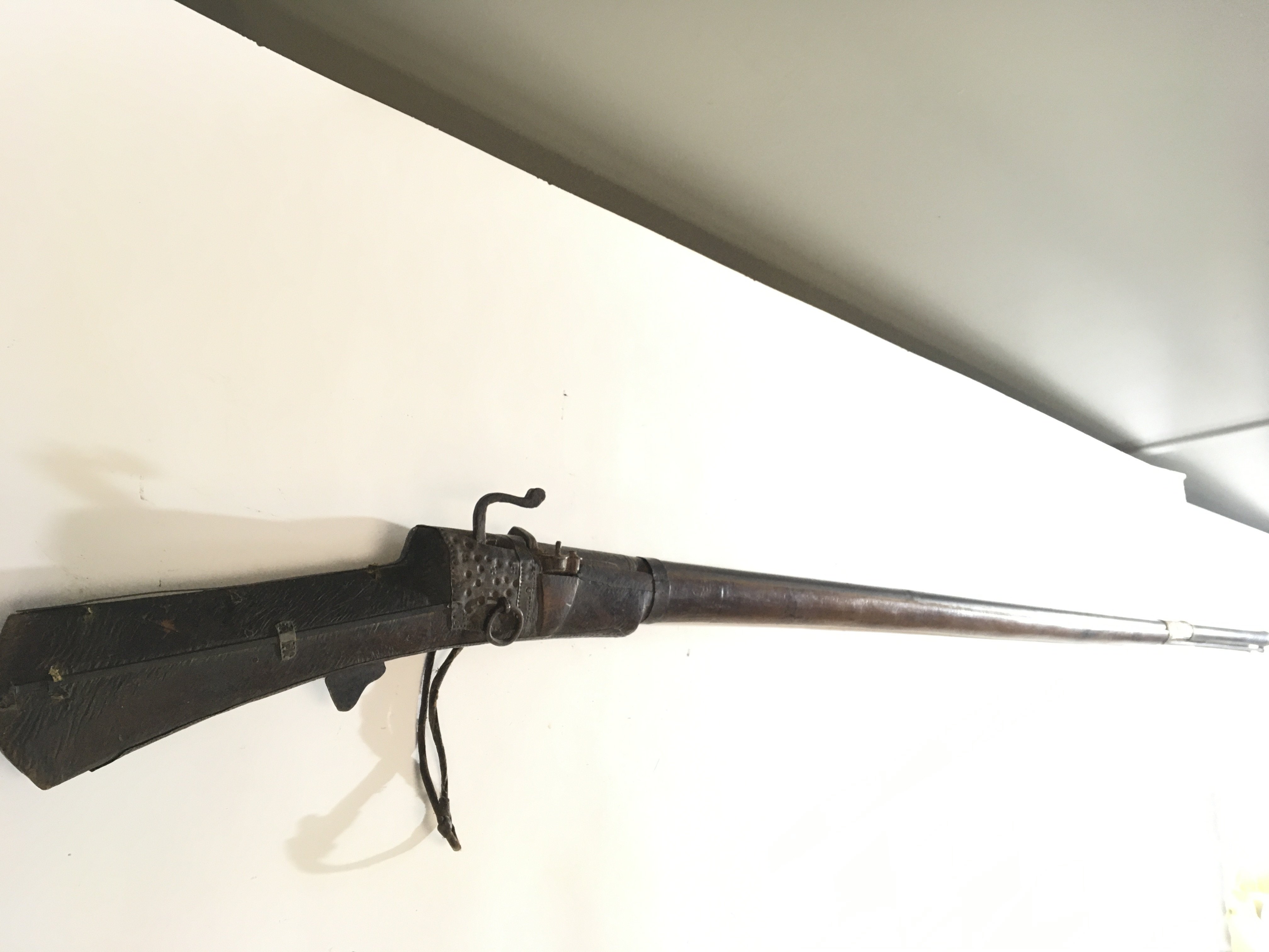An Afghan or Indian Jazail Rifle with matchlock action applied metal ornamentation.