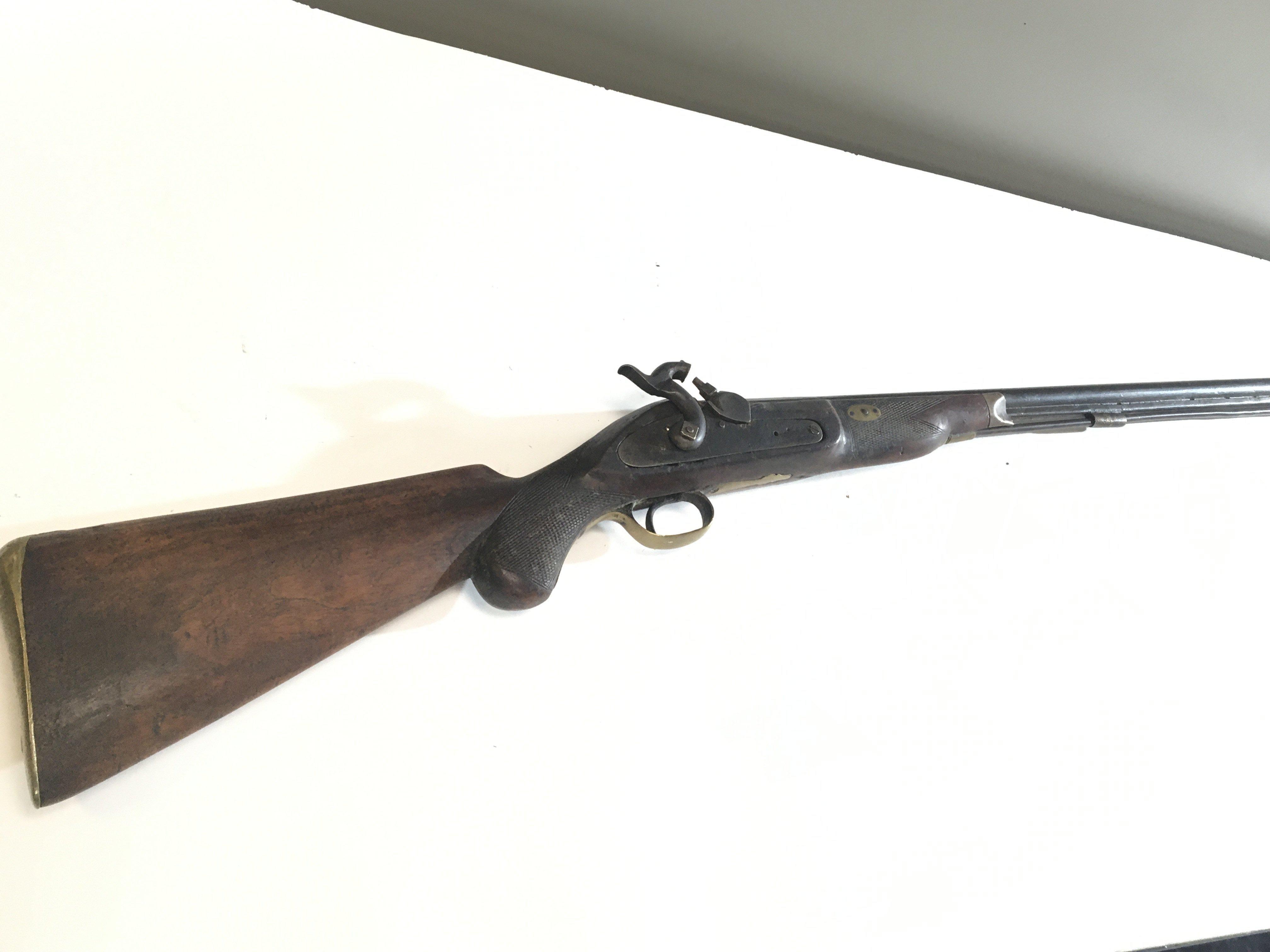 A 19th century Muzzle load Percussion sporting Rifle with brass fittings no obvious makers marks steel ram rod.