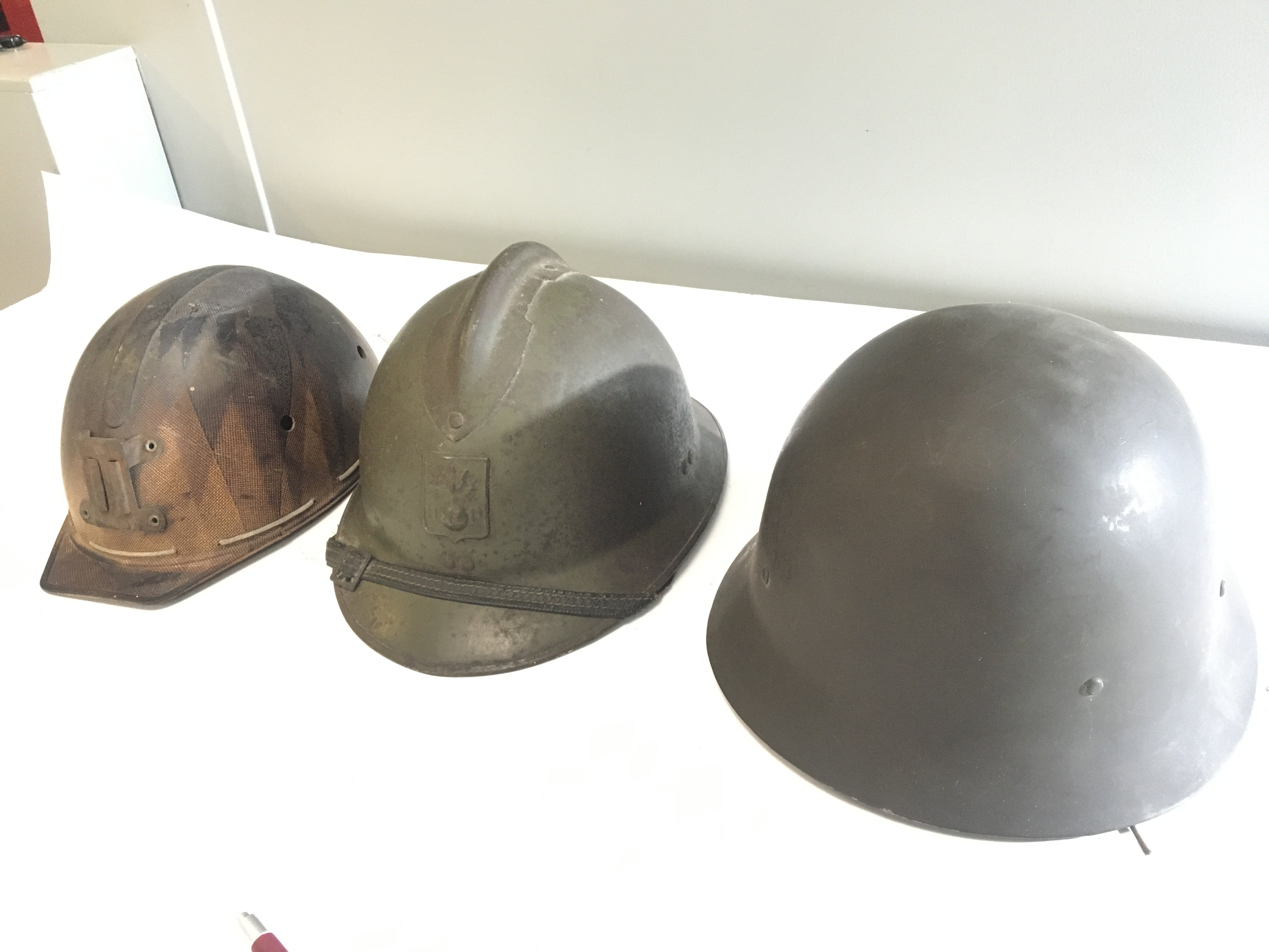 A French Military Fireman helmet a Vintage Miners helmet and a Swedish military helmet (3)