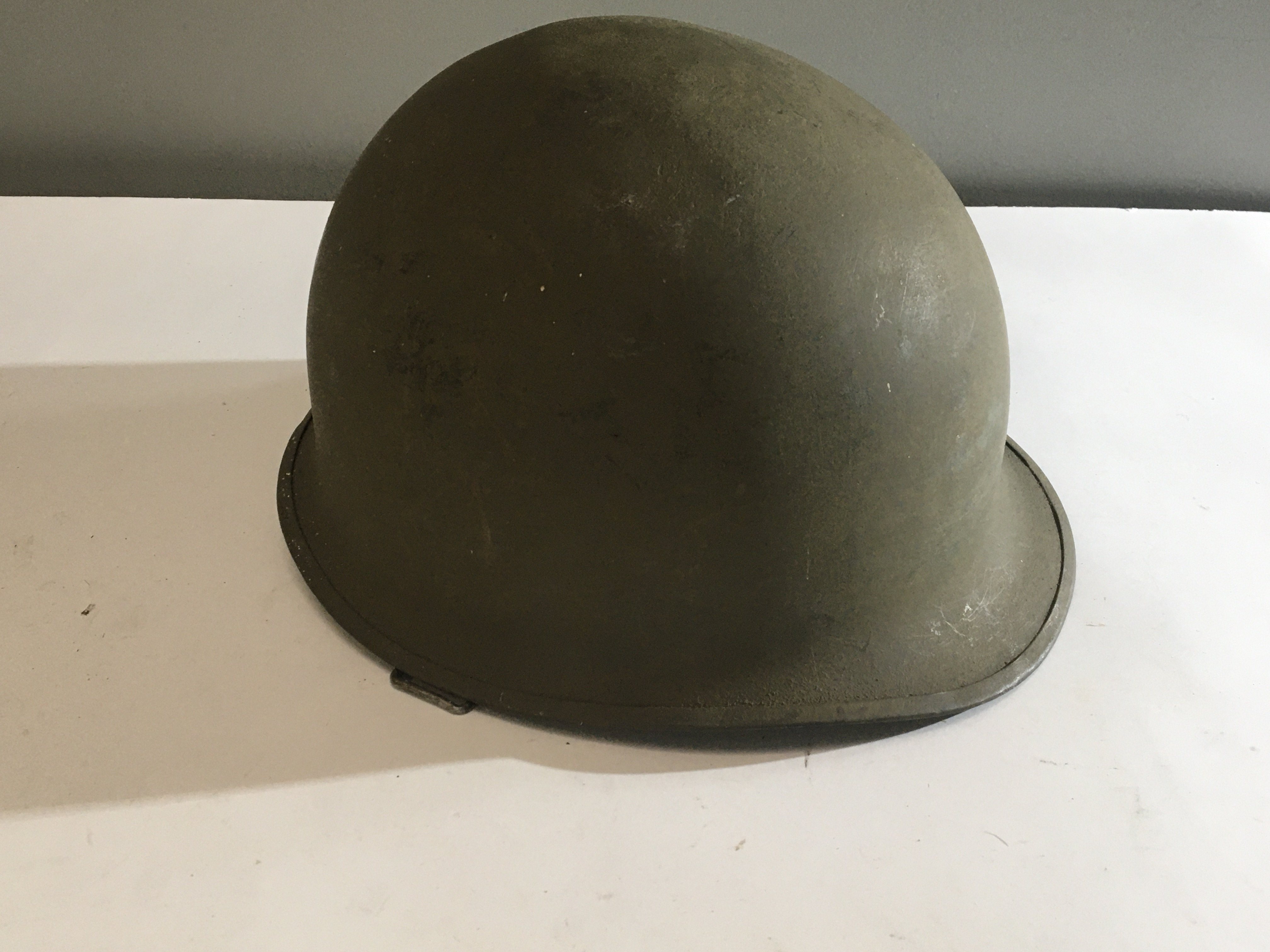A US Army Vietnam helmet Combat helmet Mk 1 with date coinciding with the finial year of the Vietnam war 1975.