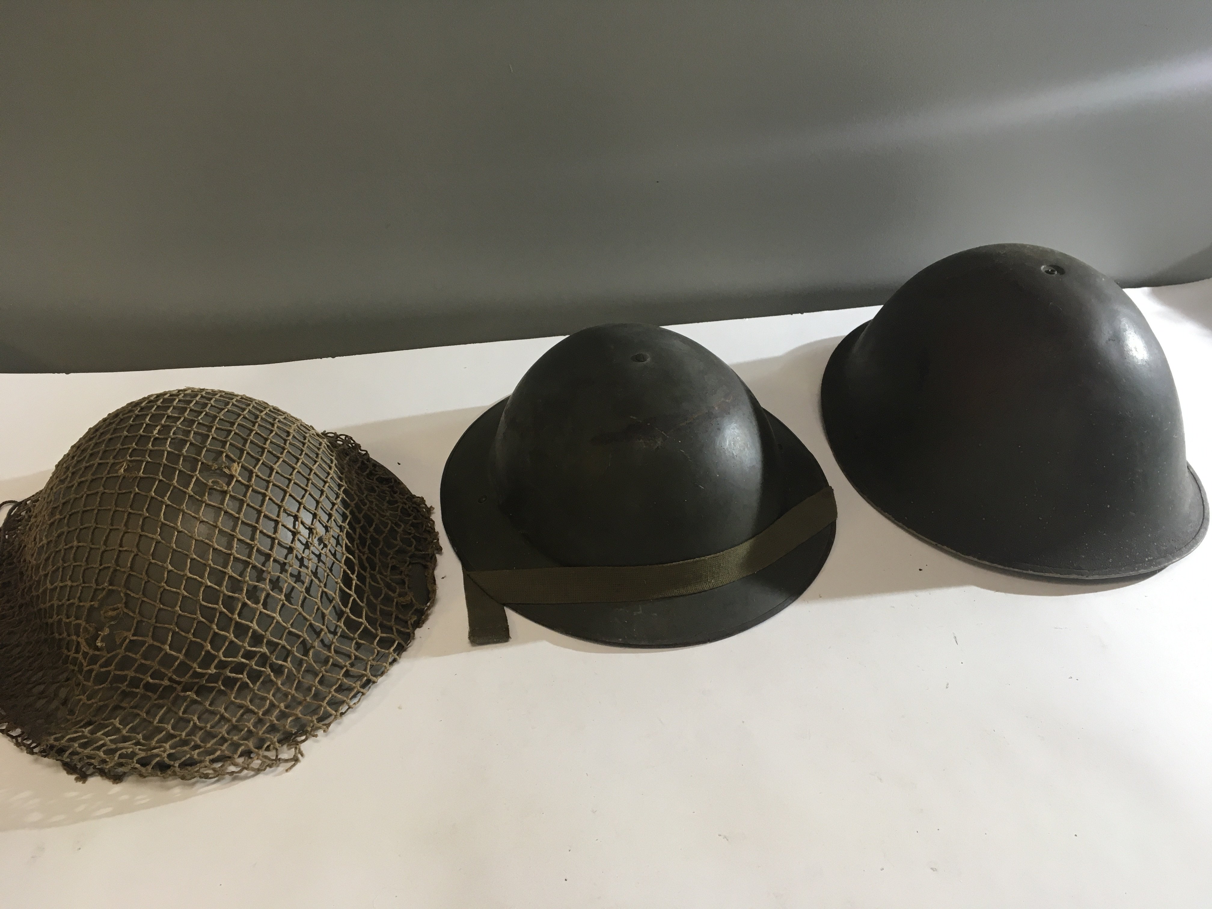 A slightly larger Military helmet cirica 1945 Mk II used possible on the D Day landing and two other conforming military helmets (3)