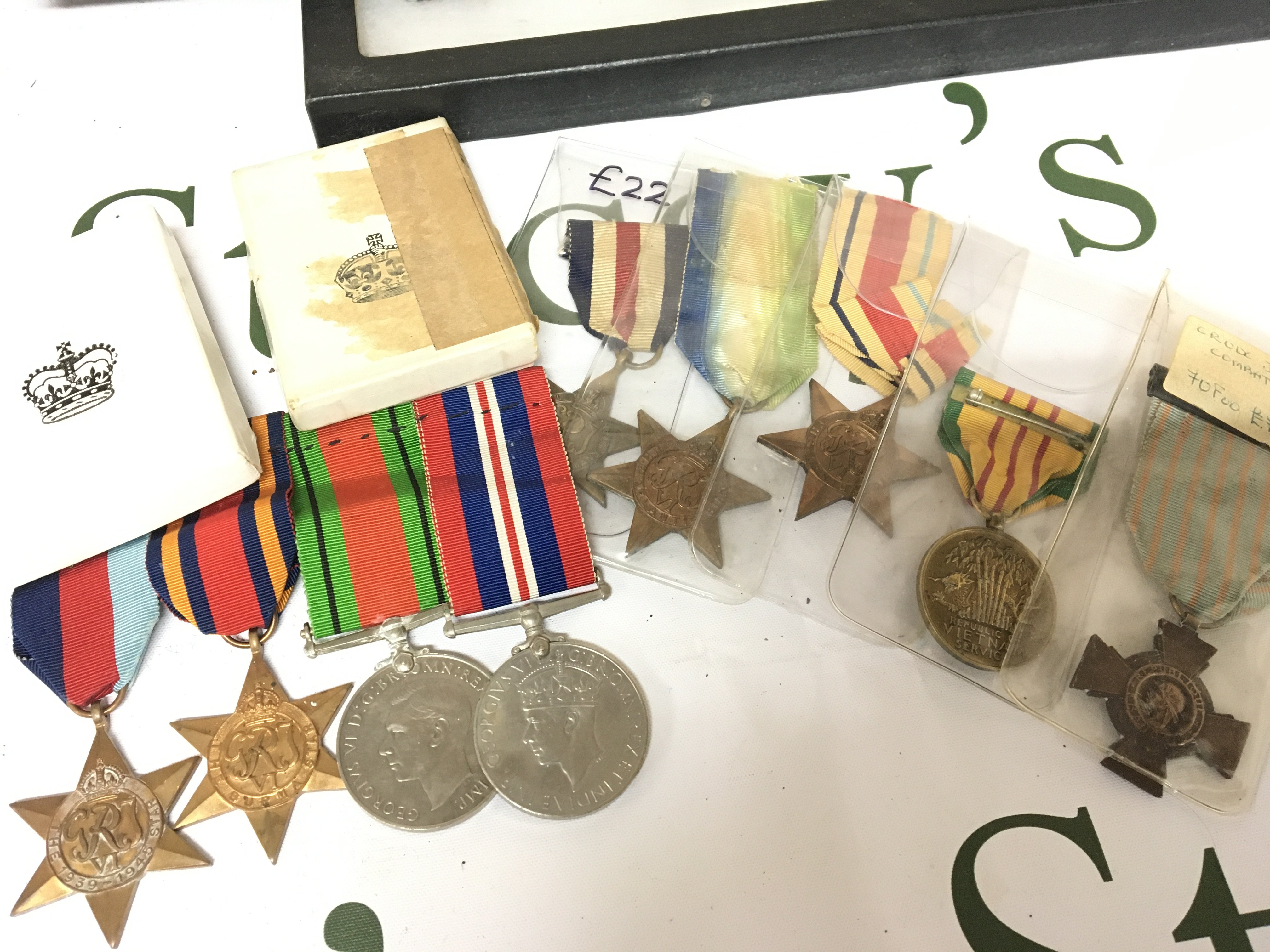 A collection of Medals including An American Vietnam service medal French Croix de Combattant. British II world war medals including Italian star Atlantic star France and German star a Group of medals including Defence and Victory medal Burma star and two other boxed medal sets,