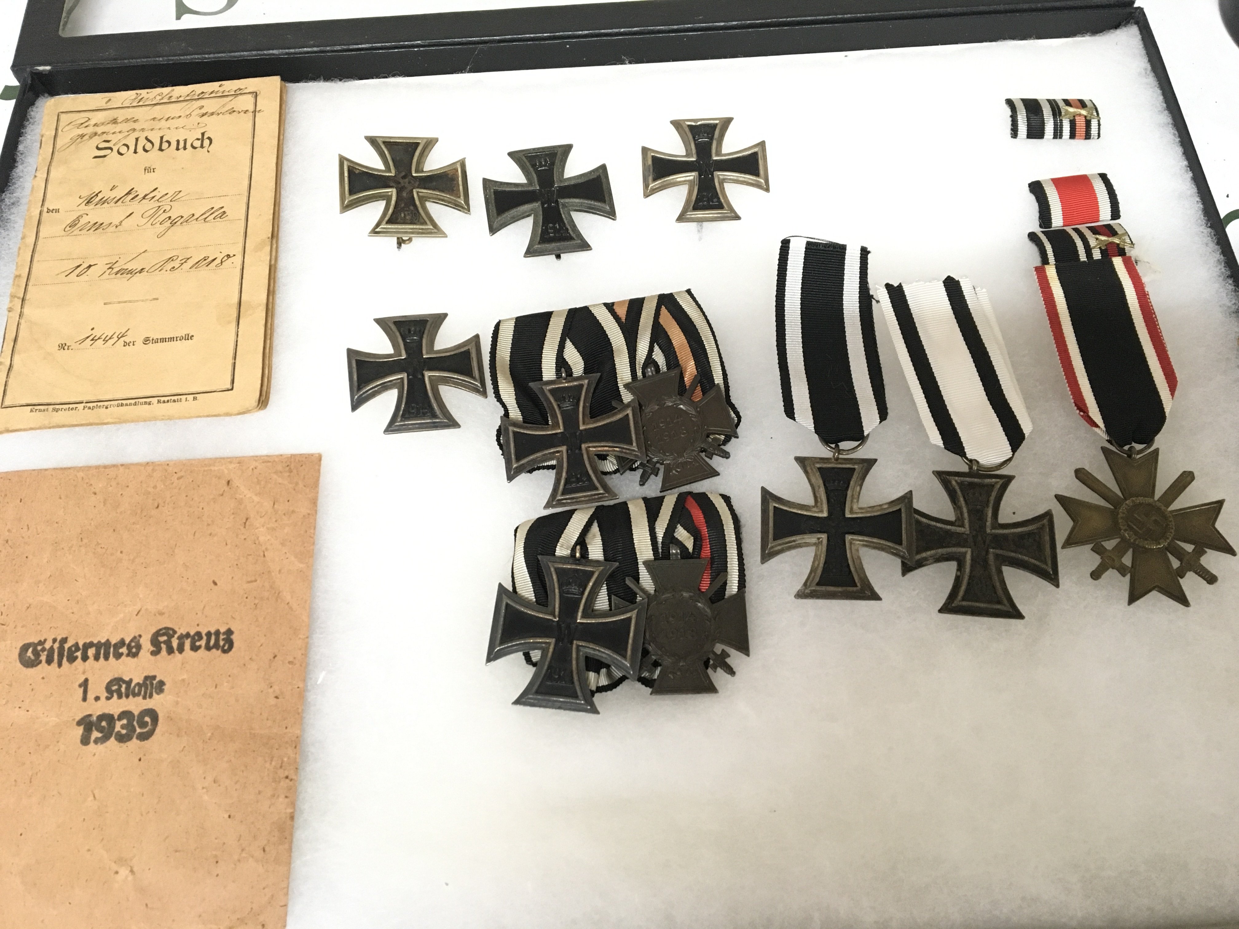 A collection of German Imperial I world war medals and award badges Iron cross second class war merit medals and Honour Cross most are authentic two badges possible reproduction please satisfy yourself before you bid. Sold with German soldiers service book p.