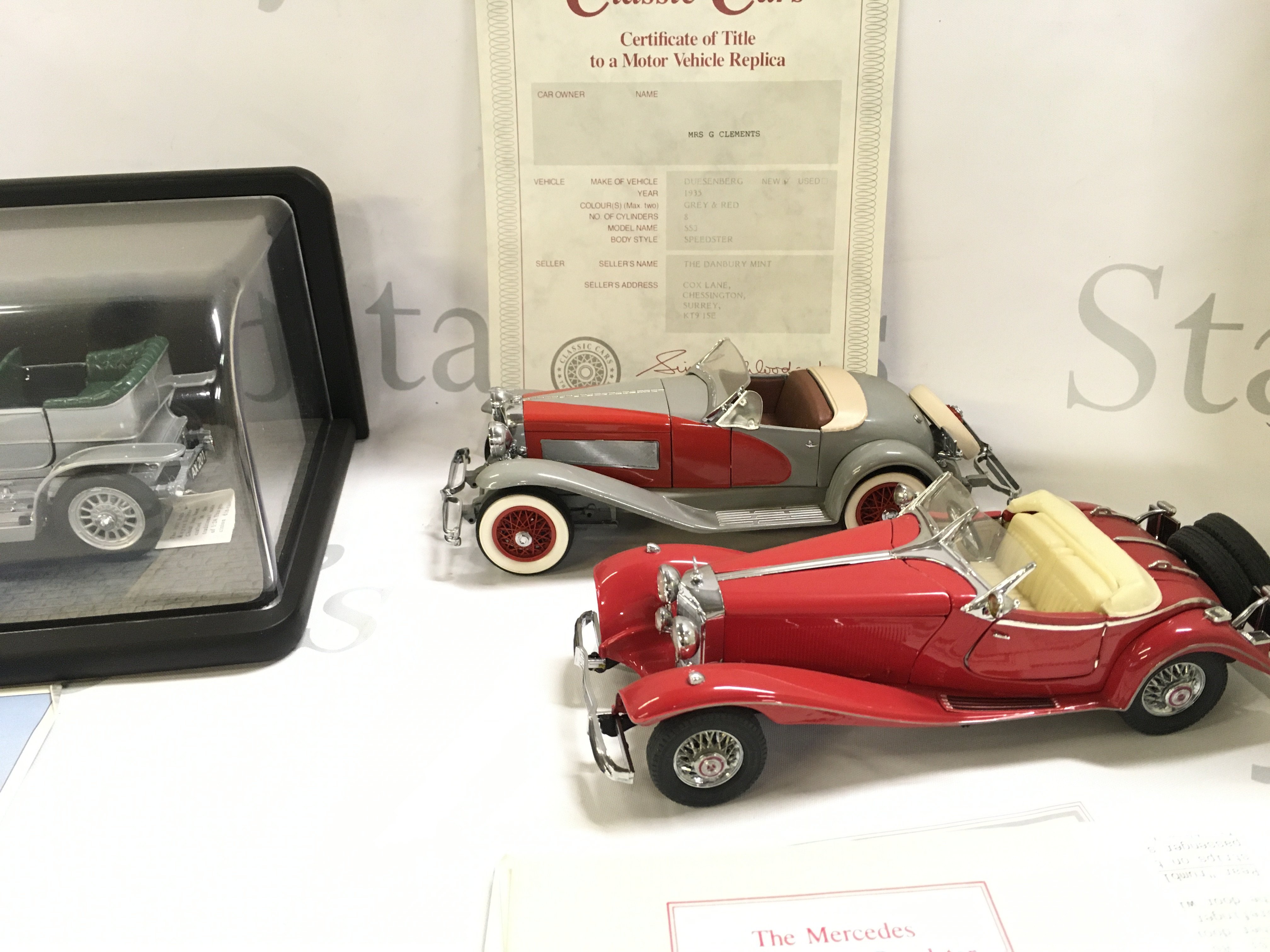 A Boxed (with Case) Franklin Mint 1907 Rolls-Royce Silver Ghost. A Danbury Mint Duesenberg And A Mercedes 500K Special Roadster.(3).