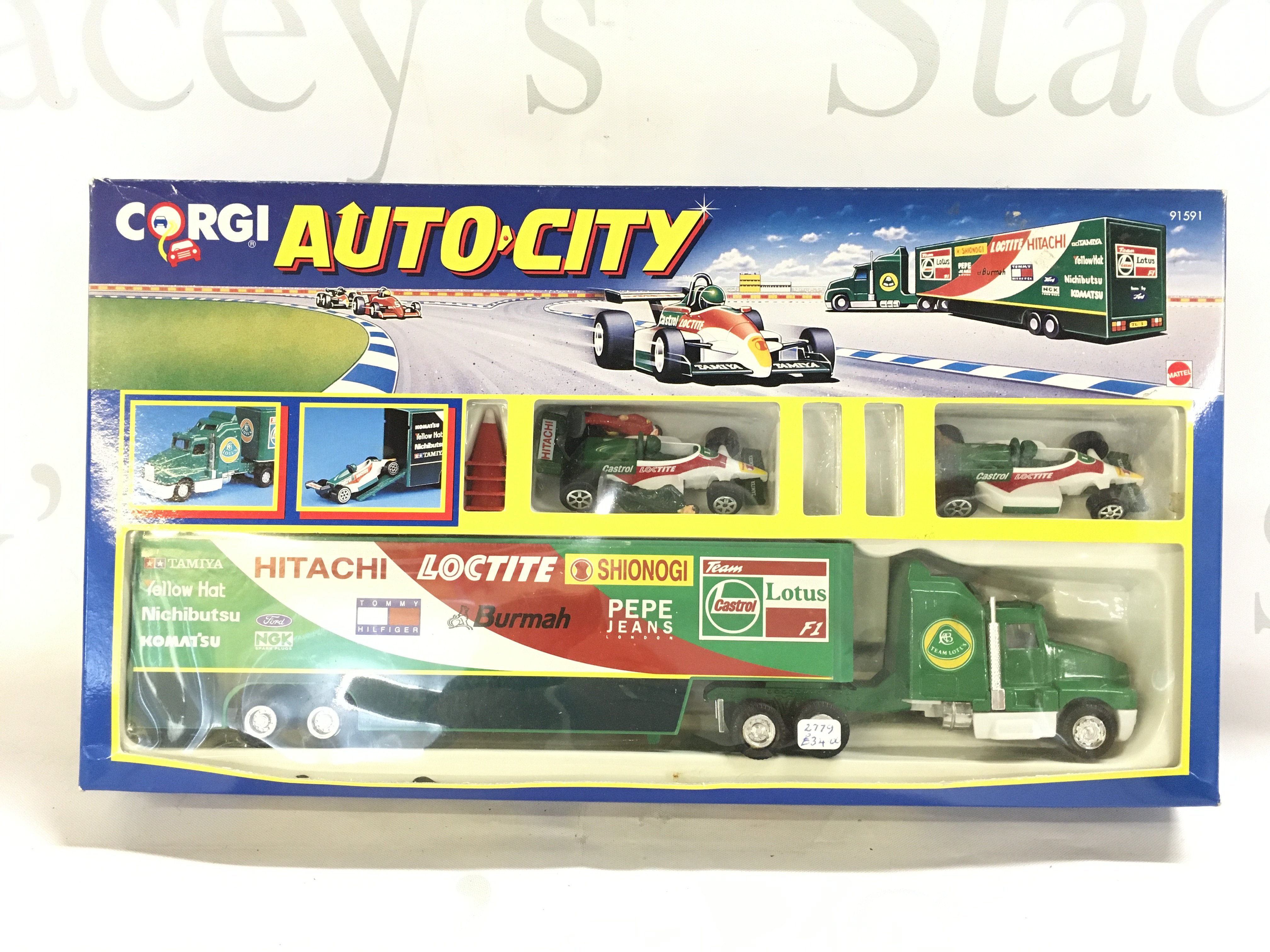A Boxed Corgi Auto City Team Lotus.