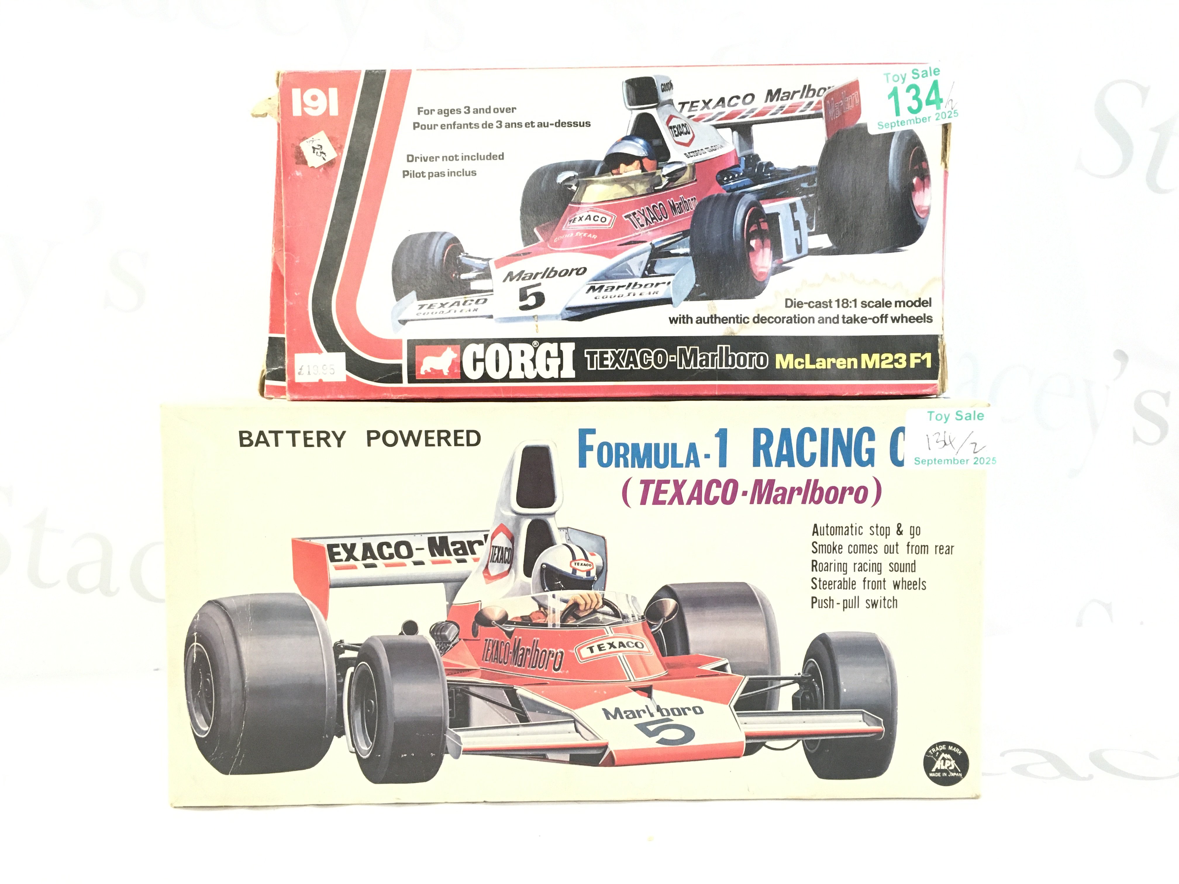 A Vintage Alps Japanese Battery Powered Formula 1 Smoking Race Car. And A Corgi Texaco-Marlboro McLaren M23F1 #191.