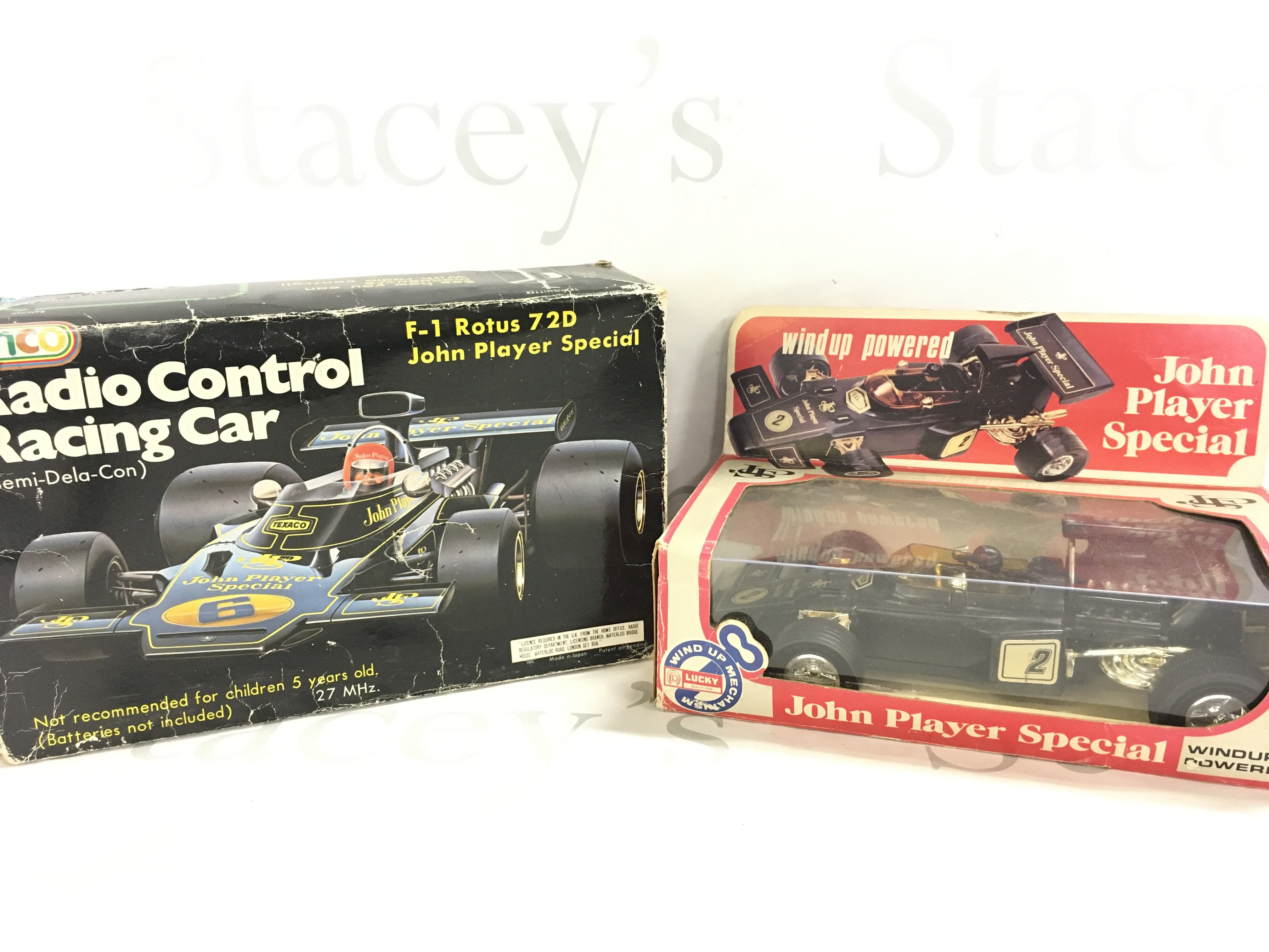 A Boxed Einco Radio Controlled J.P.S. Racing Car And a Lucky Toys Wind Up Powered Racing Car.(2).