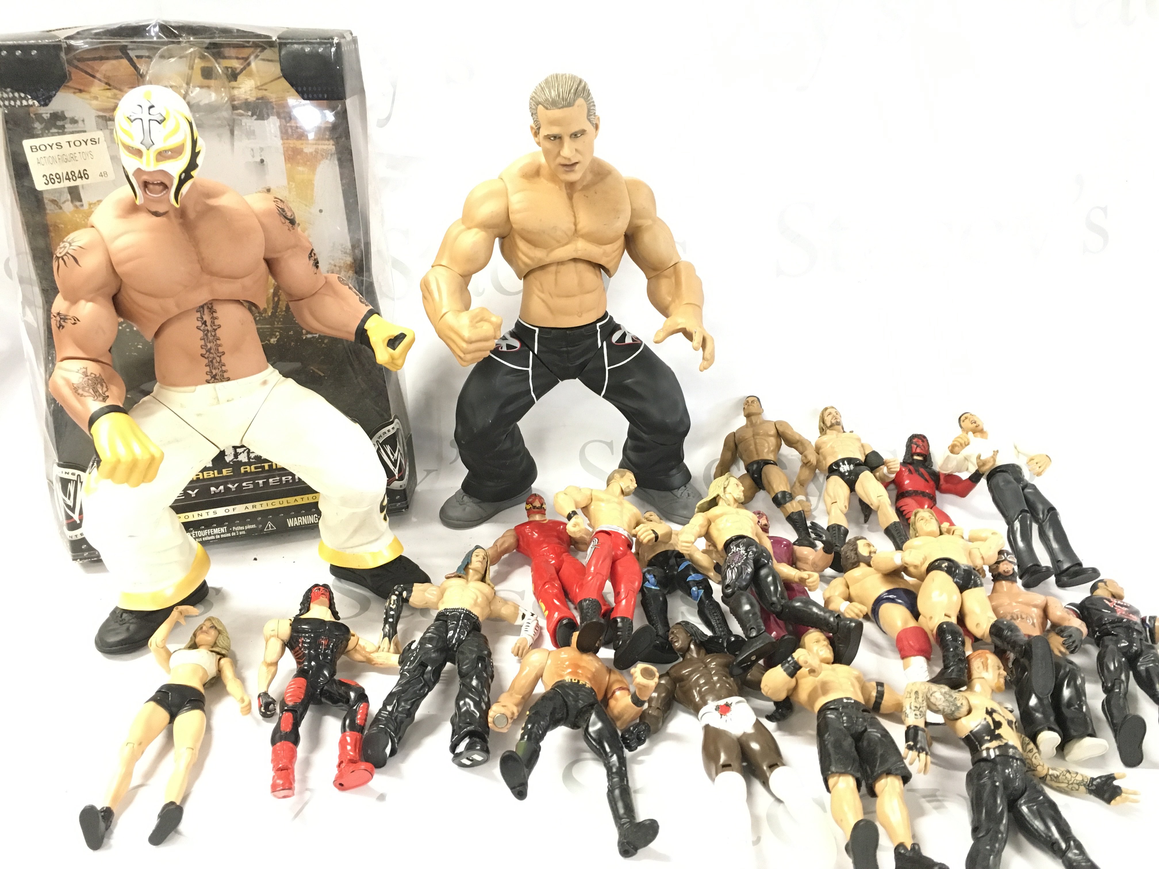 A Collection Of WWE Wrestling Figures Including 2 Ring Giants. No Reserve.