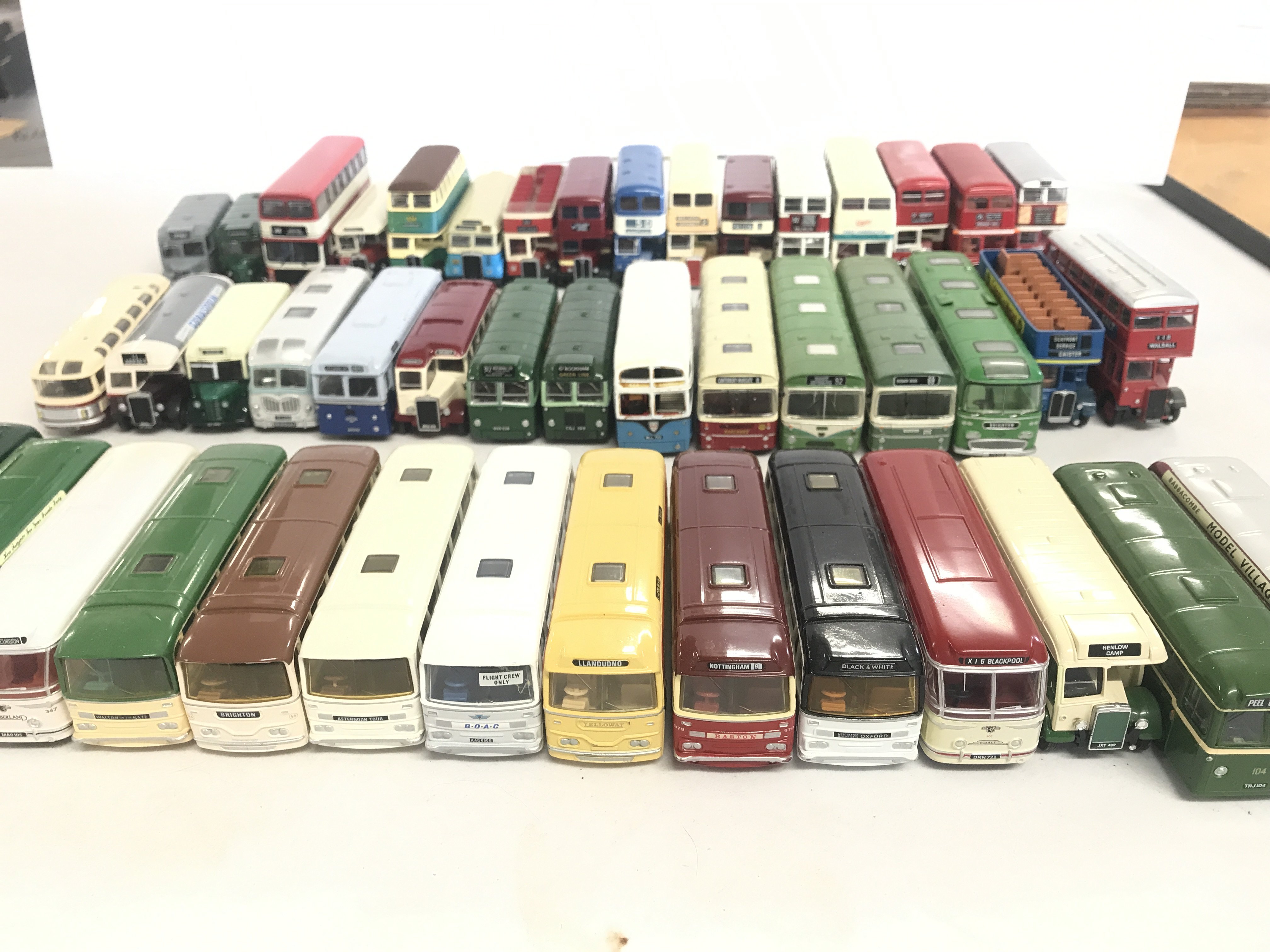 A box containing a collection of various busses to include Oxford and Corgi.