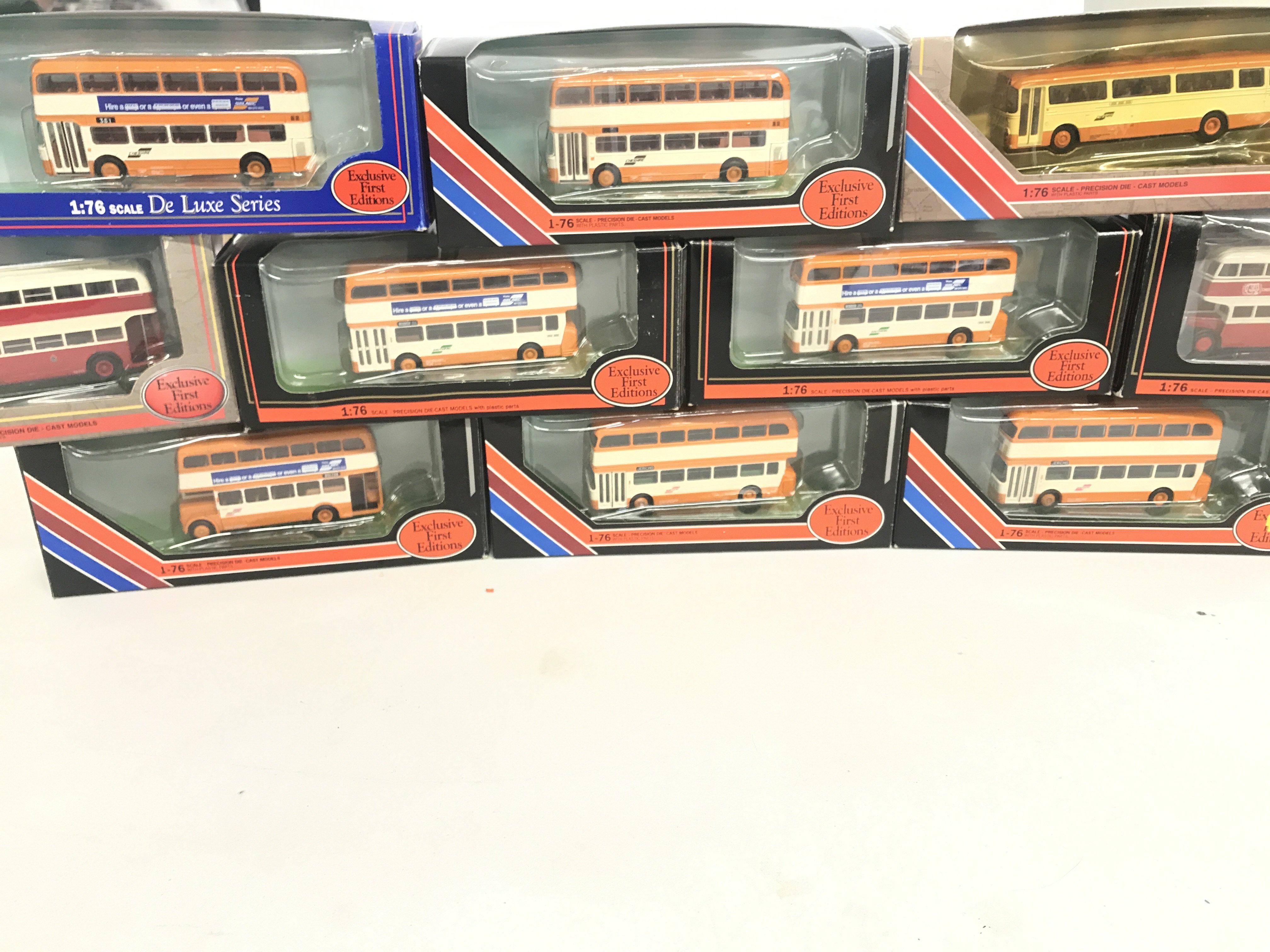 A box containing a collection of Exclusive First edition busses.