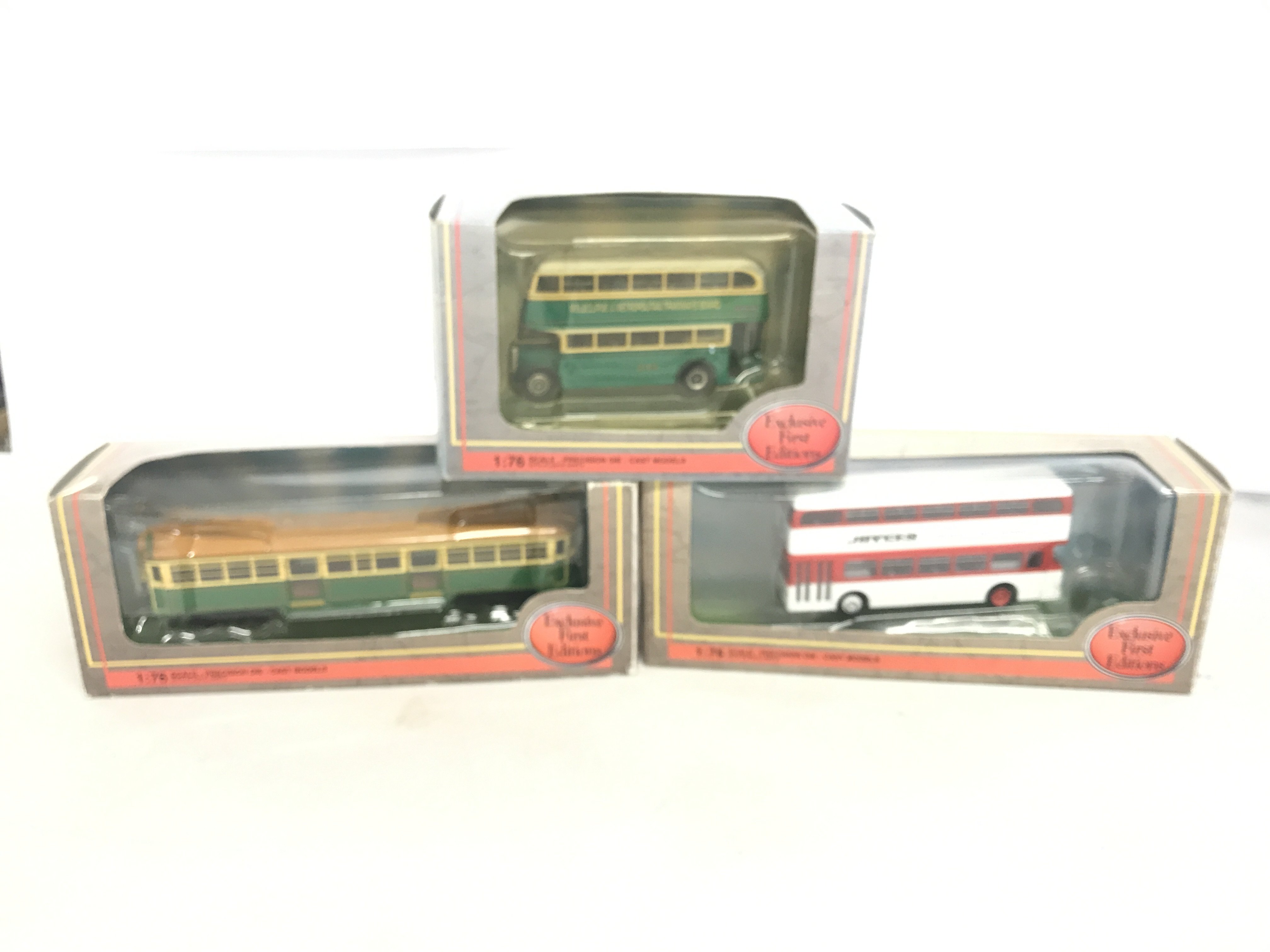 A box containing various model busses to include Limited First Editions and Trux.