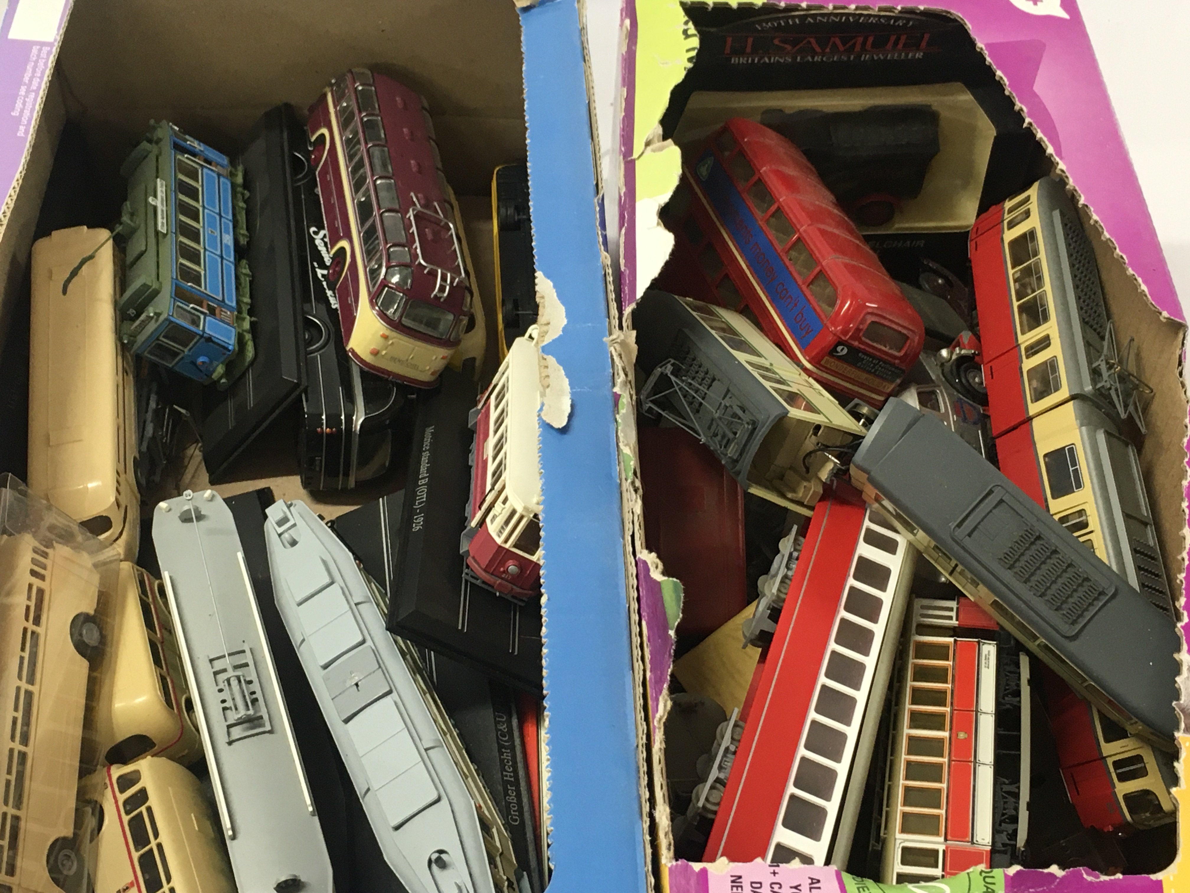 A mixed collection of diecast and plastic model vehicles including buses ..trams etc. No reserve (2)