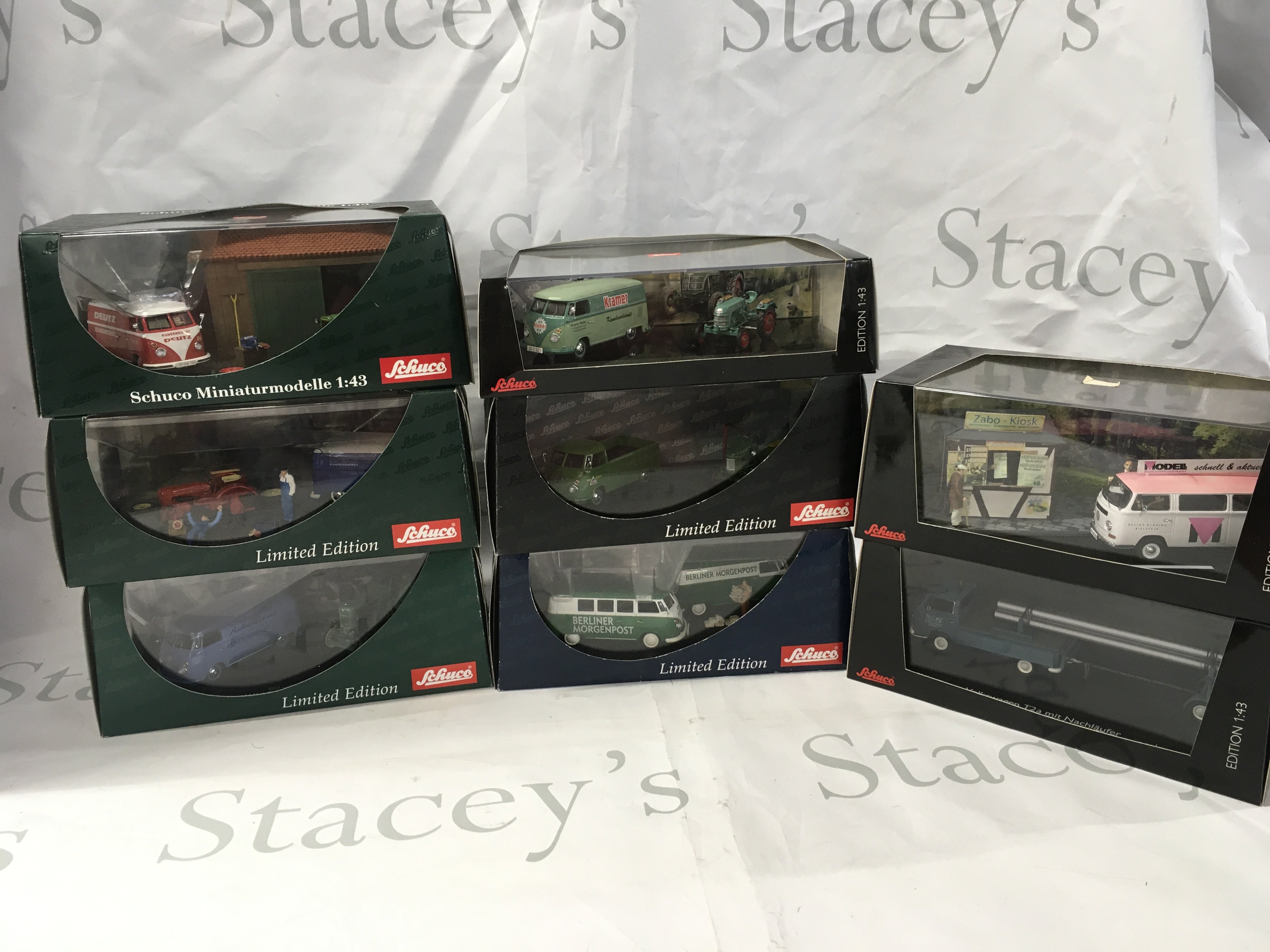 A collection of 8 display boxed diecast model Volkswagens some with dioramas. No reserve