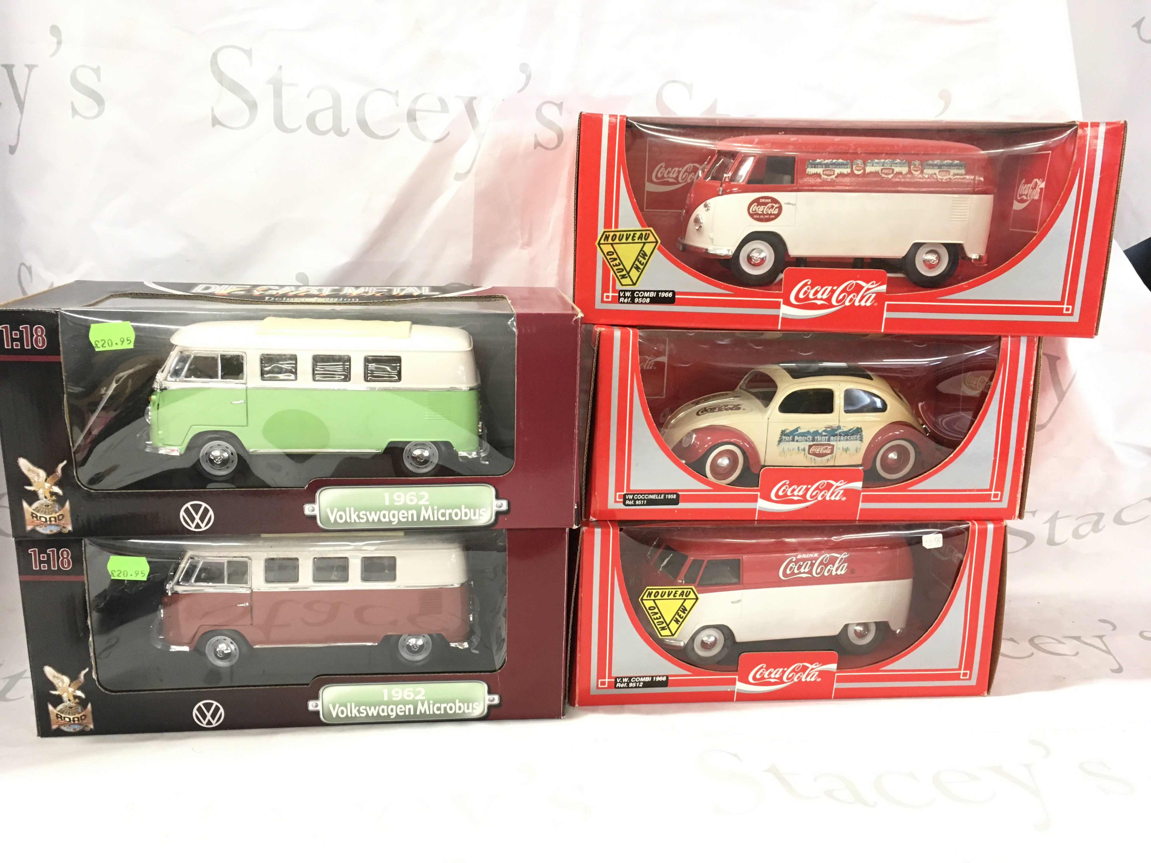A collection of 5 boxed model Volkswagen vehicles by Solido and Road Signature includes 1962 Microbus and Coca Cola liveries. 1..18 scale. No reserve