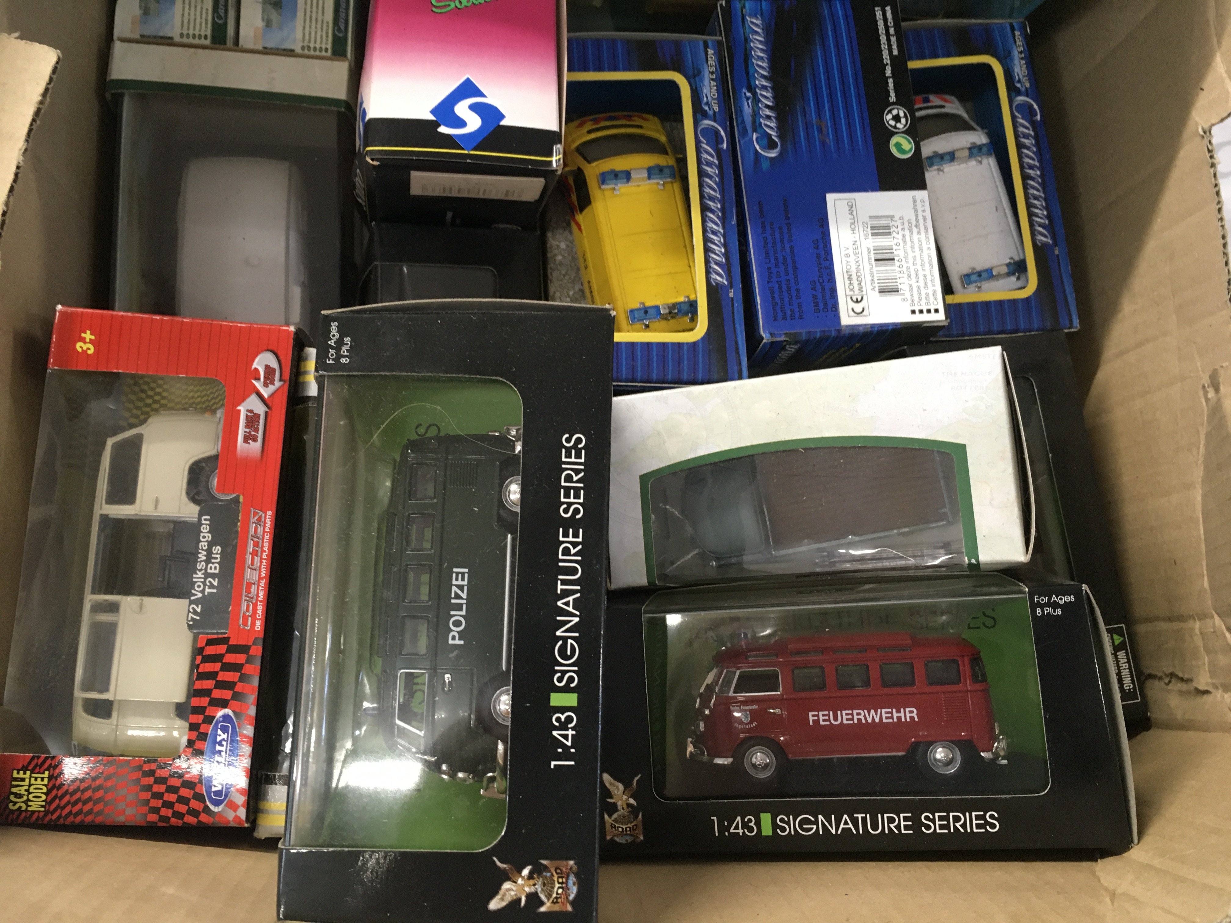 A box containing an assortment of boxed model vehicles mainly Volkswagen. No reserve.
