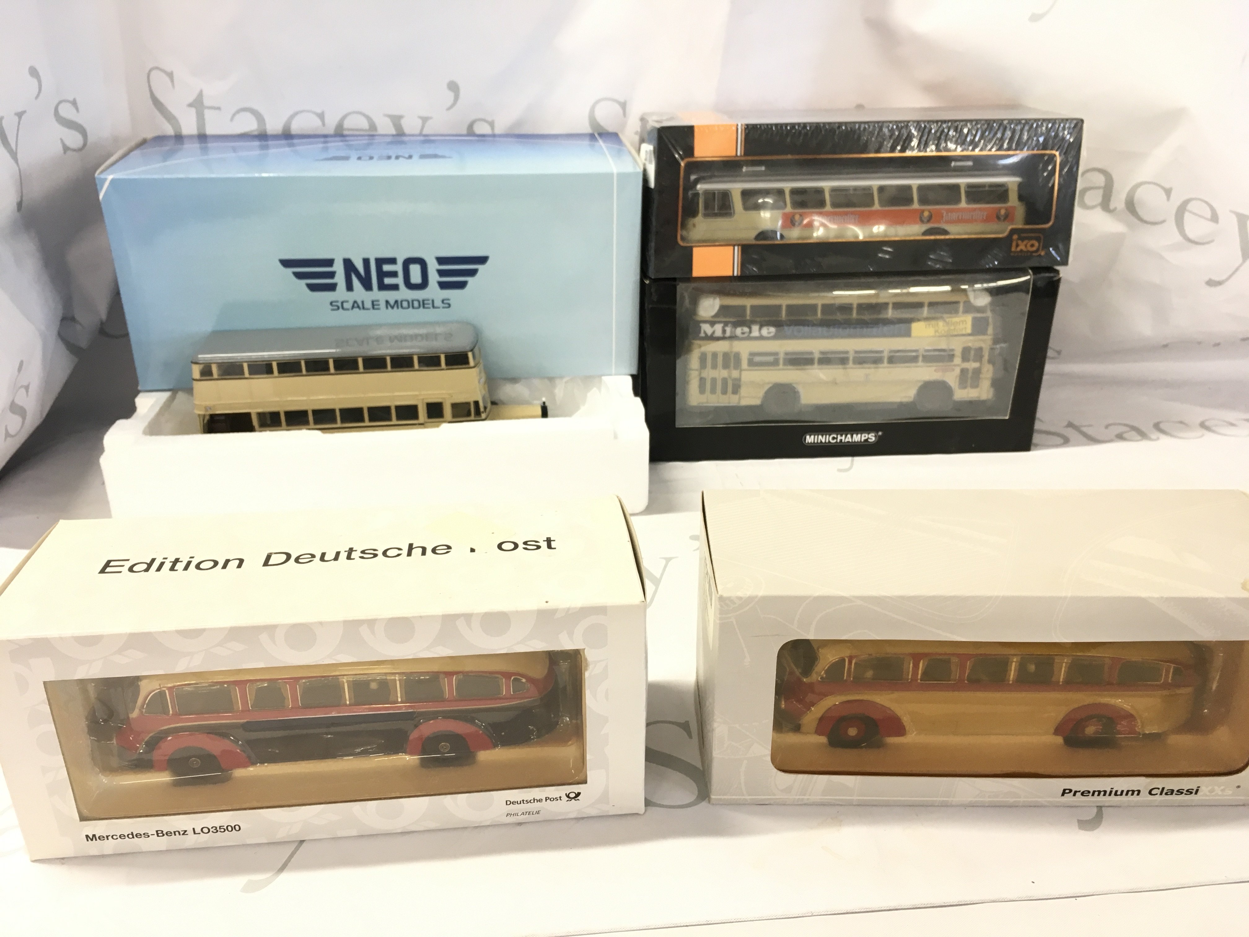 A Collection of 5 boxed diecast model buses. Manufacturers include NEO..Minichamps..ixo etc. No reserve