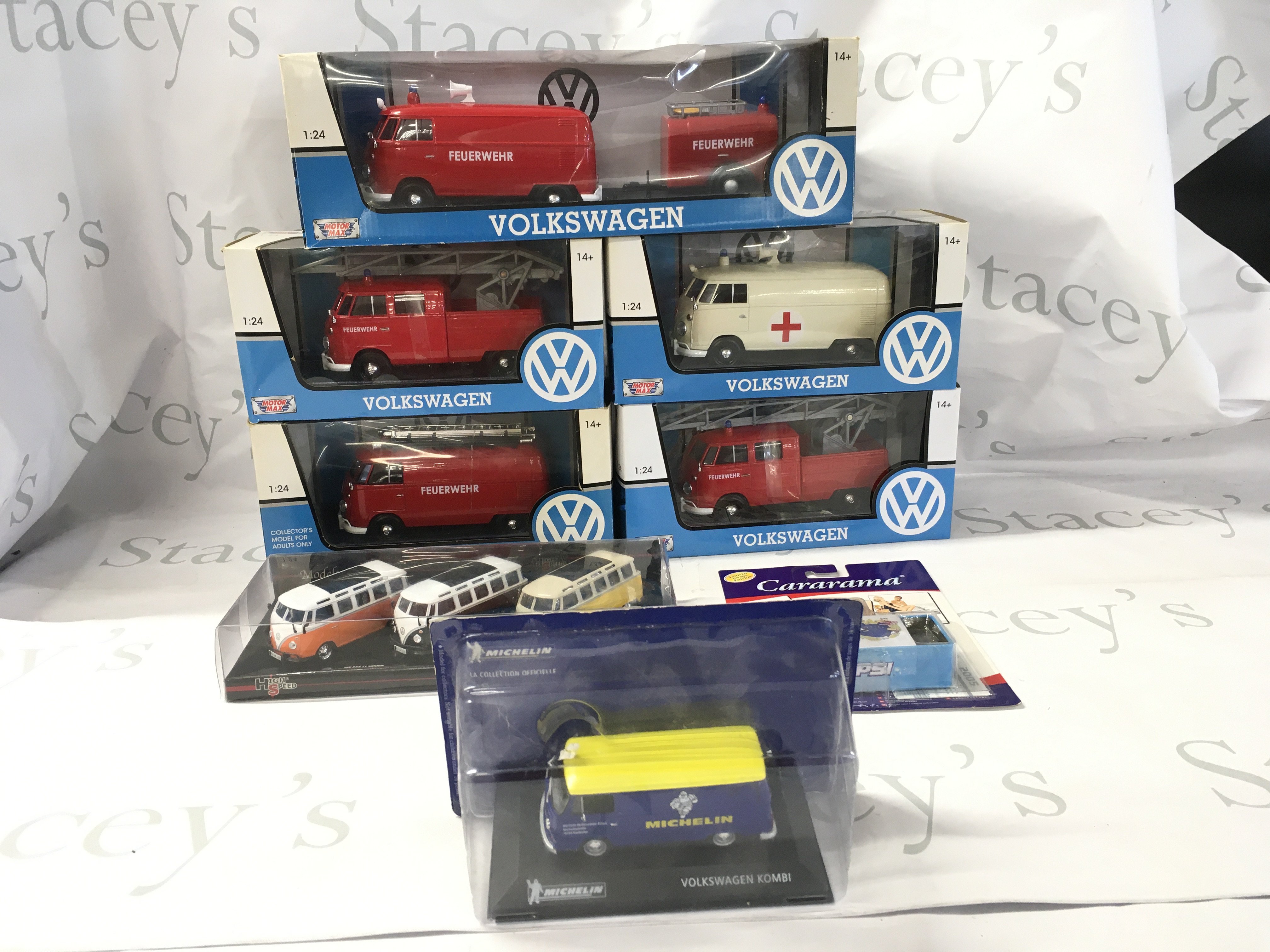 A collection of boxed model diecast Volkswagen vehicles including some emergency service vehicles. No reserve.
