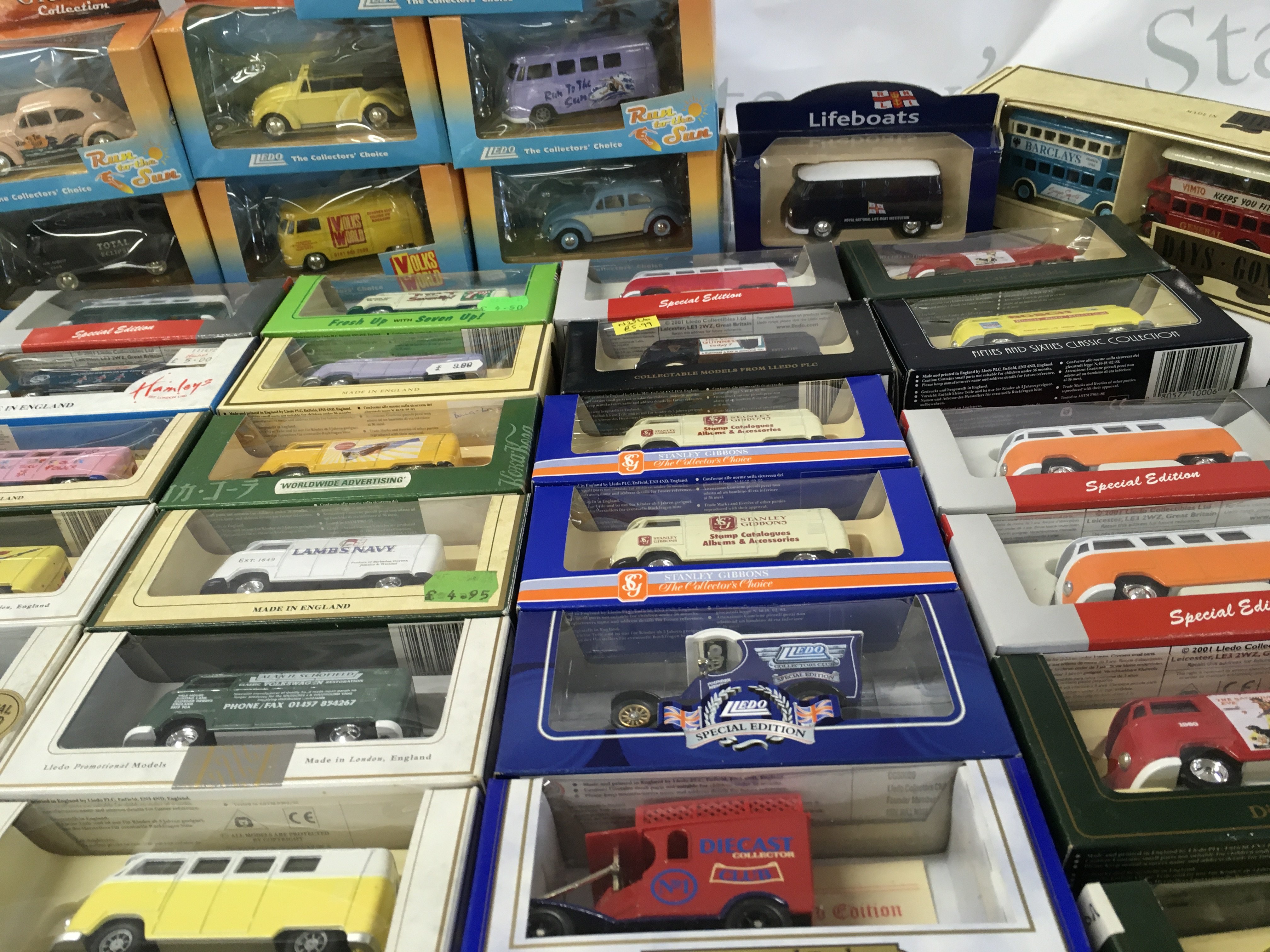 A collection in excess of 60 boxed diecast model vehicles predominately Volkswagen featuring many promotional livery . No reserve