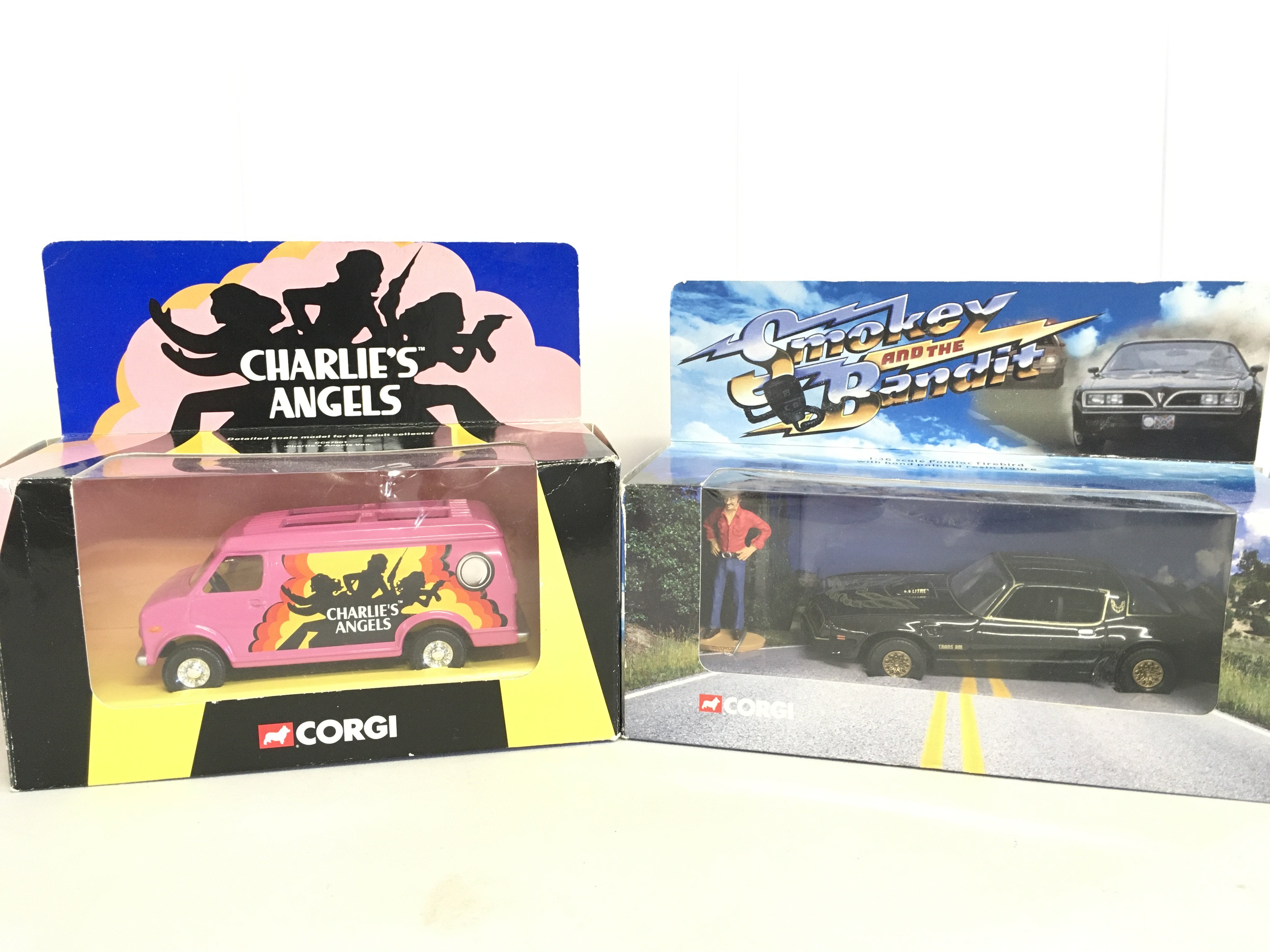 A Boxed Corgi Charlies angels Van And A Smokey And The Bandit Pontiac Firebird.(2).