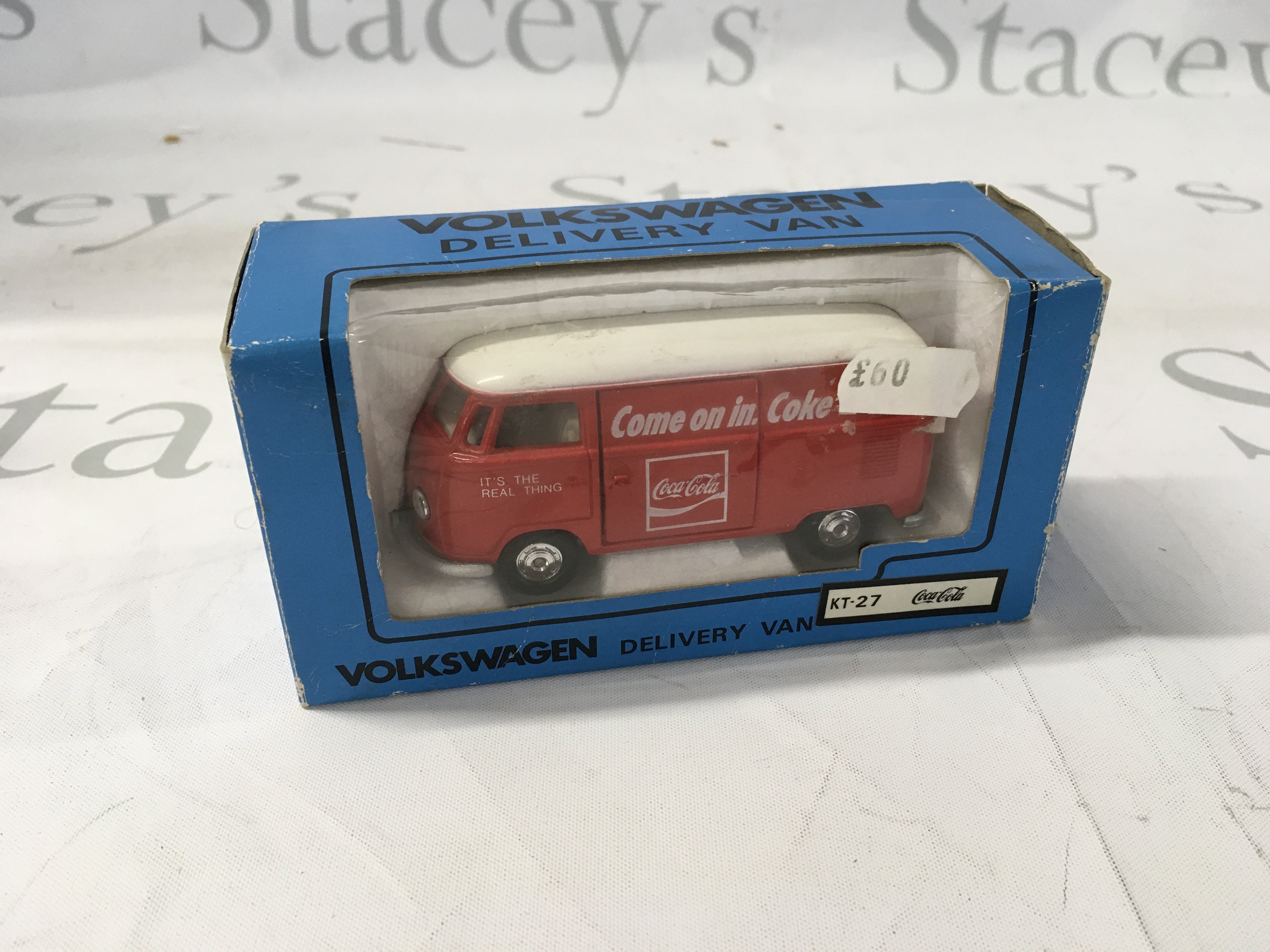 A boxed Volkswagen model van by Kado in exclusive Coca Cola livery. No reserve