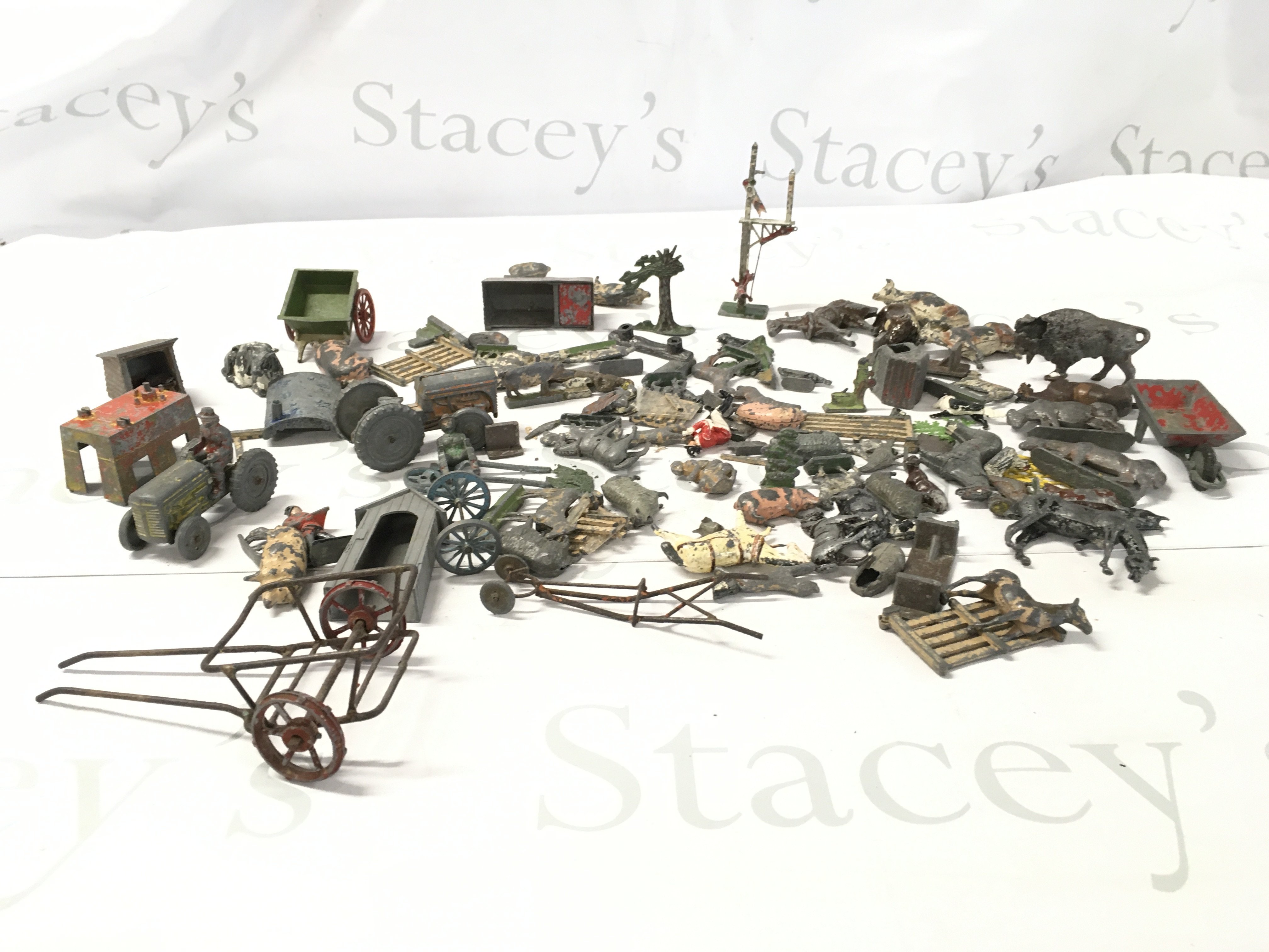 A collection of metal and lead toys primarily farm related equipment and animals. No reserve