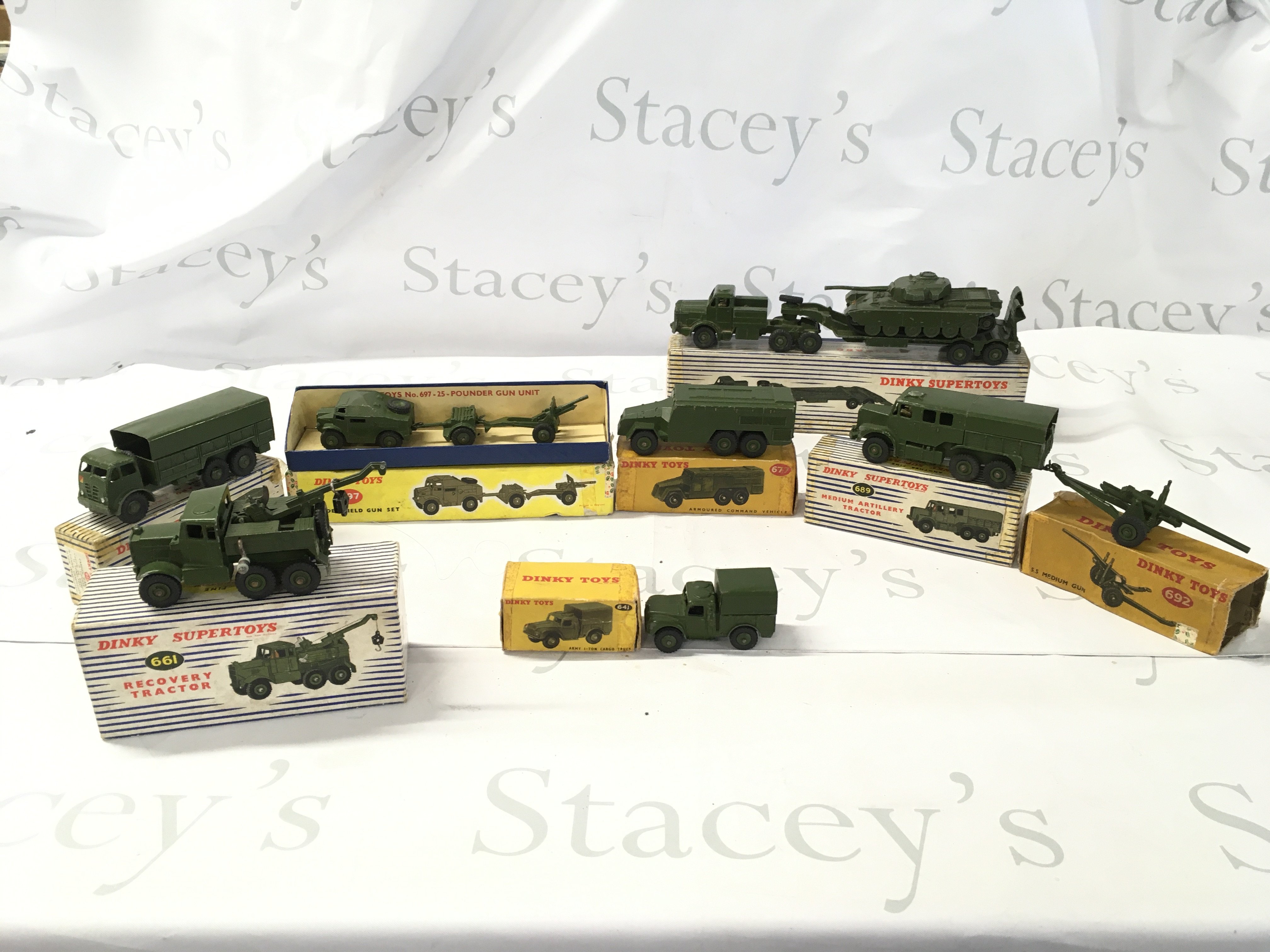 A collection of 8 boxed Dinky military vehicles plus unboxed 651 Centurion tank for 660 tank transporter. Boxes in worn condition. No reserve