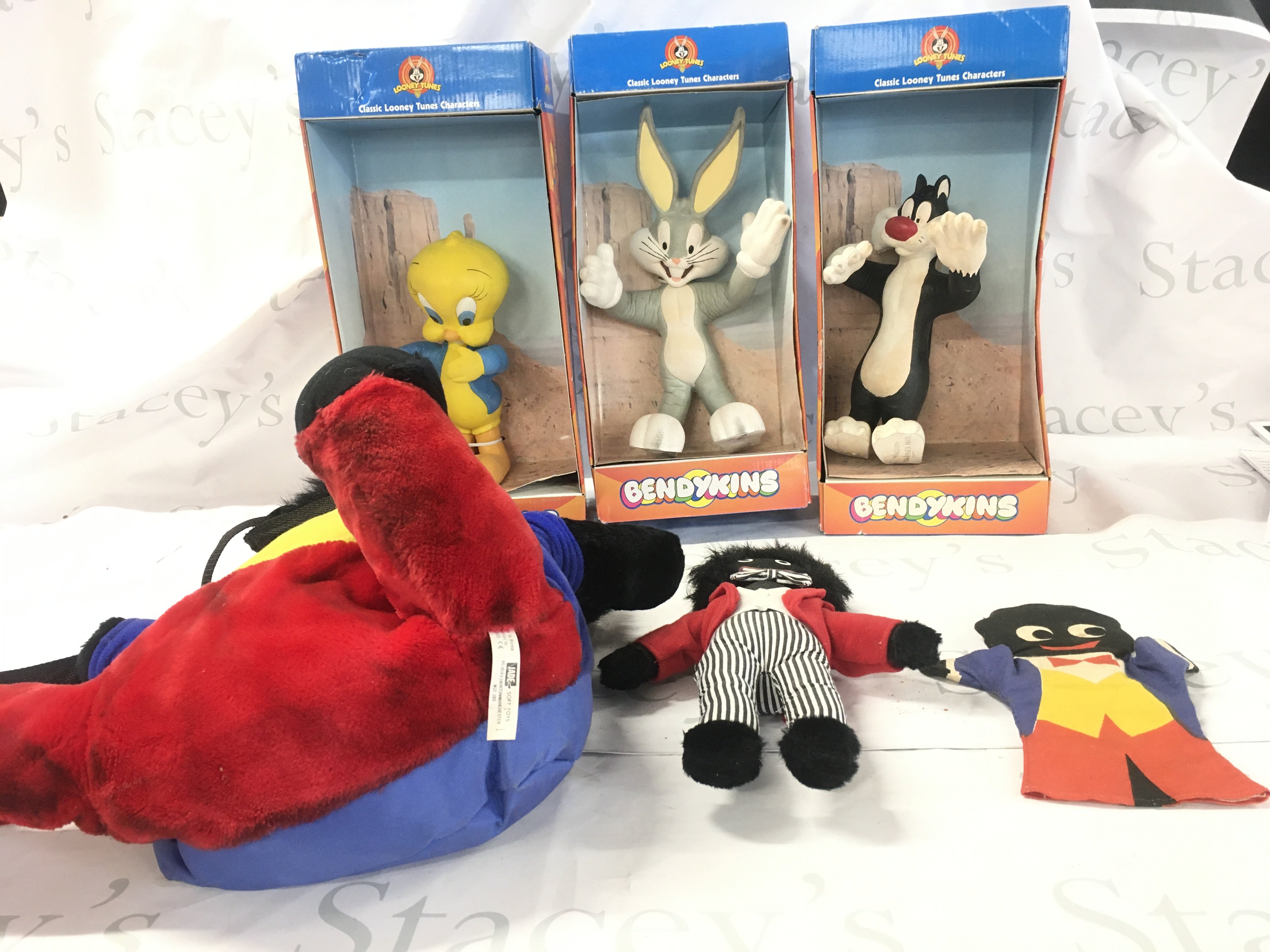 3 x boxed looney tunes bendykins featuring Bugs bunny..Sylvester and Tweety Pie. Also 3x gollies a doll..a hand puppet..a backpack. No reserve