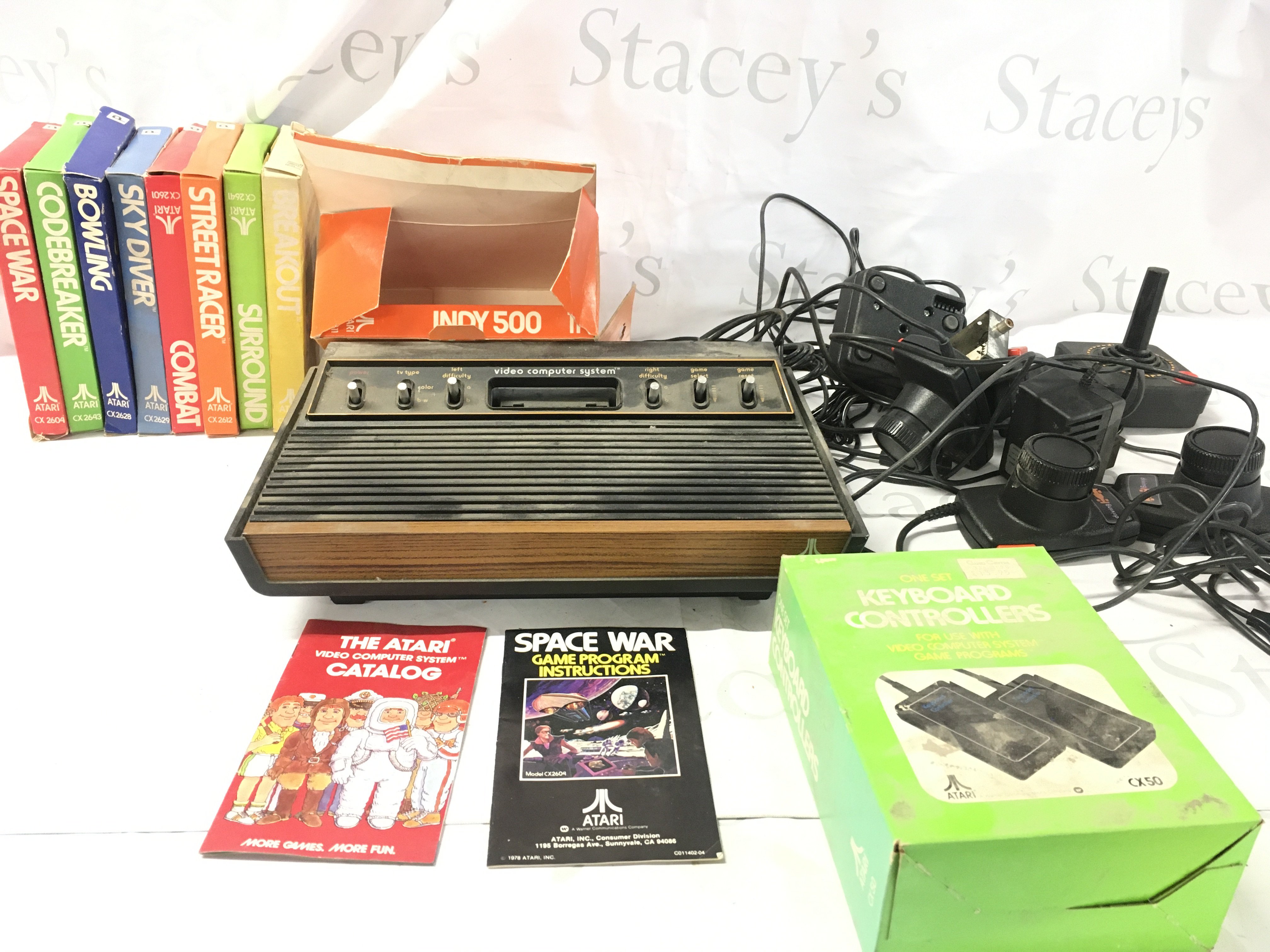Atari CX2600 video computer system..includes console..controllers and power supply..a number of games cartridges. No reserve