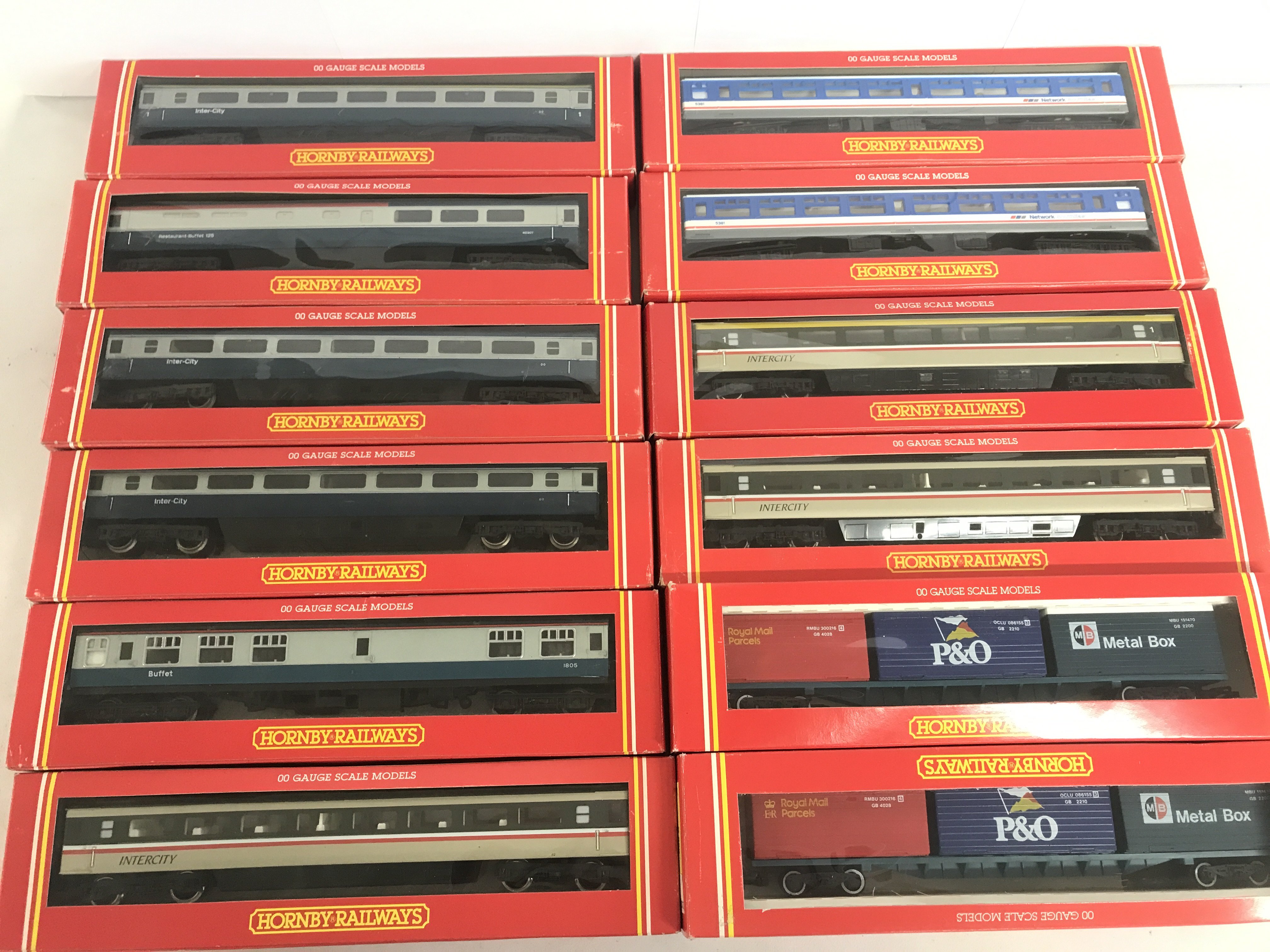 A Collection Of Boxed Hornby 00 Gauge Coaches And Freightliner Wagons.