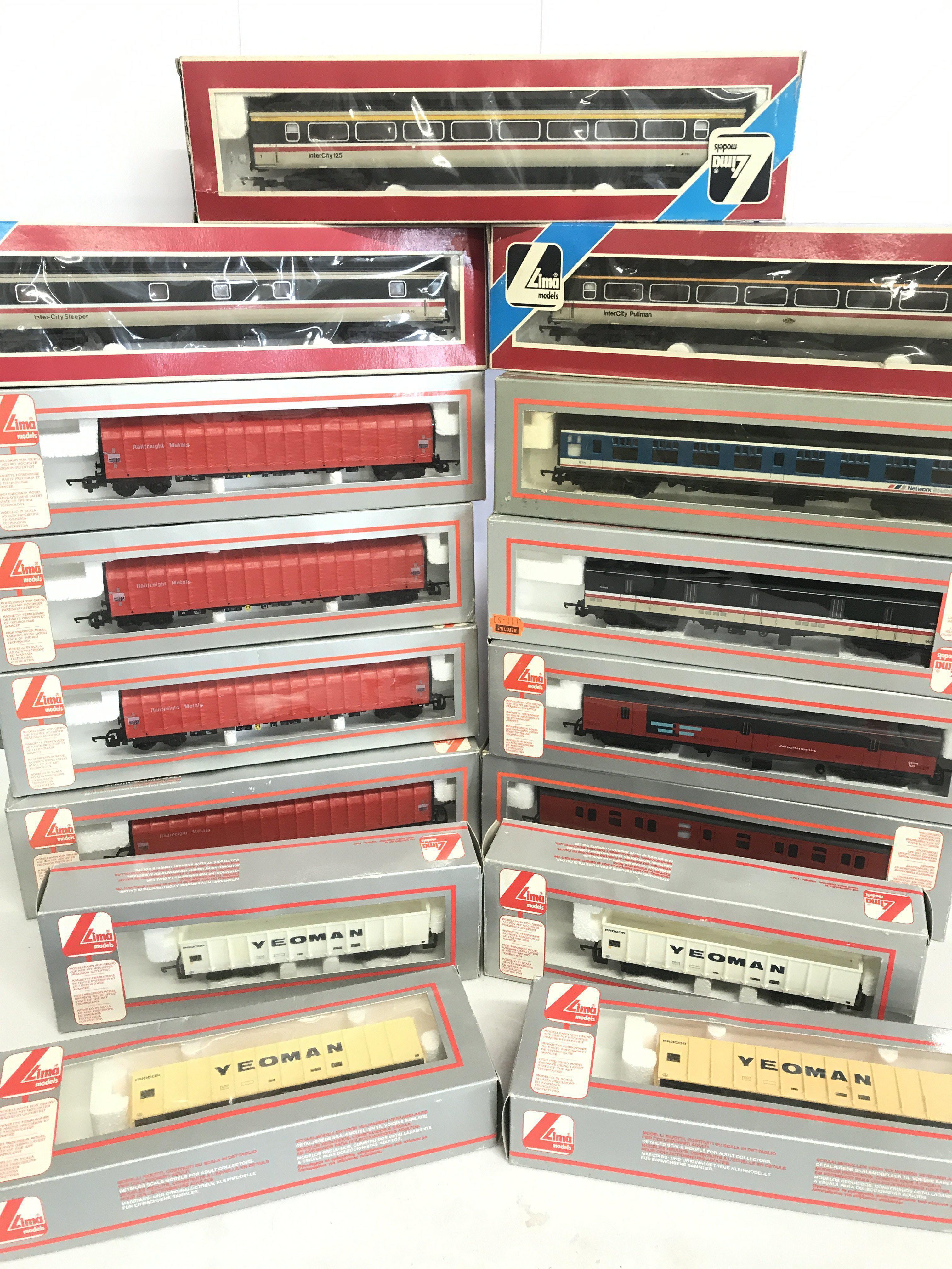 A Collection of Boxed Lima 00 Gauge Coaches And Wagons.