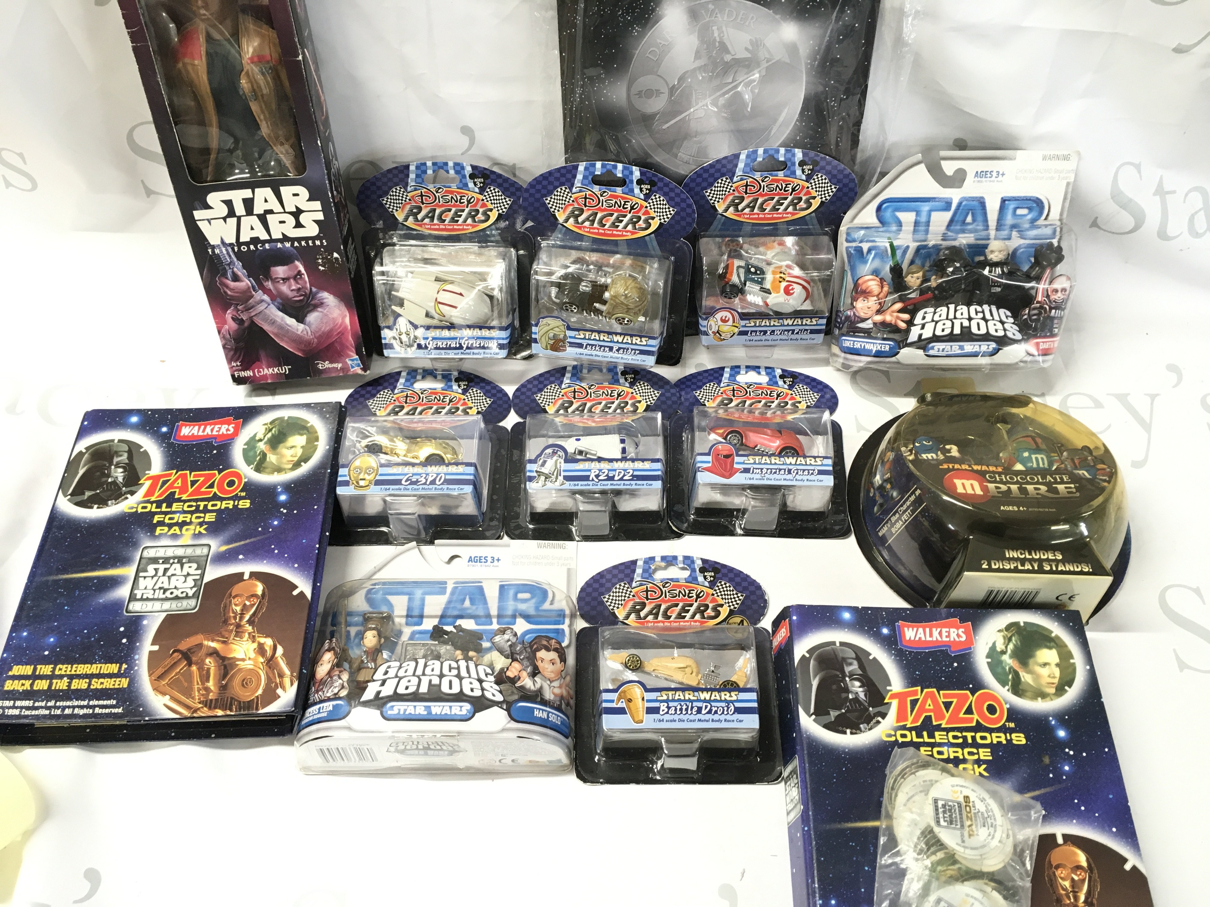 A Collection Of Various Star Wars Toys Including Disney Racers. Galactic Hero&rsquo;s. Tazos etc.