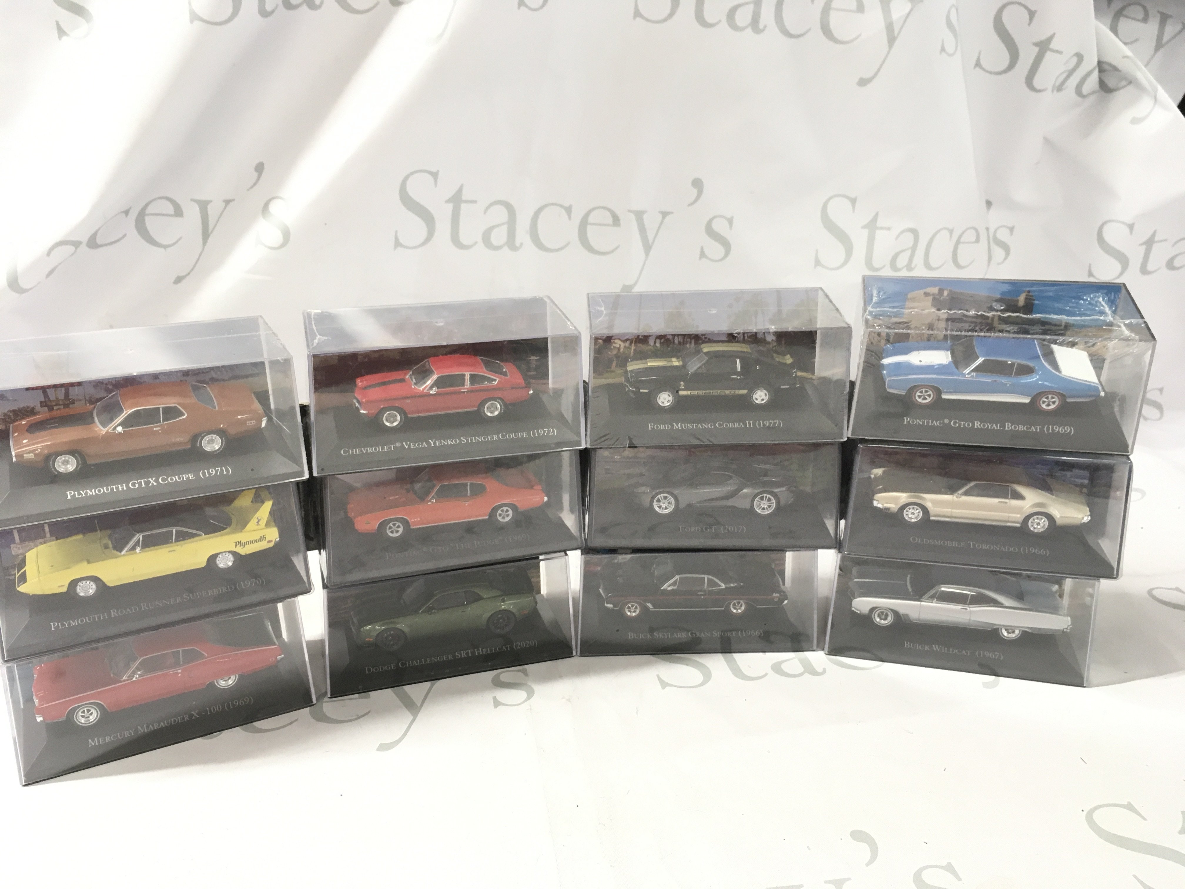 A collection of boxed diecast model cars mostly unopened by various manufacturers featuring American cars. No reserve