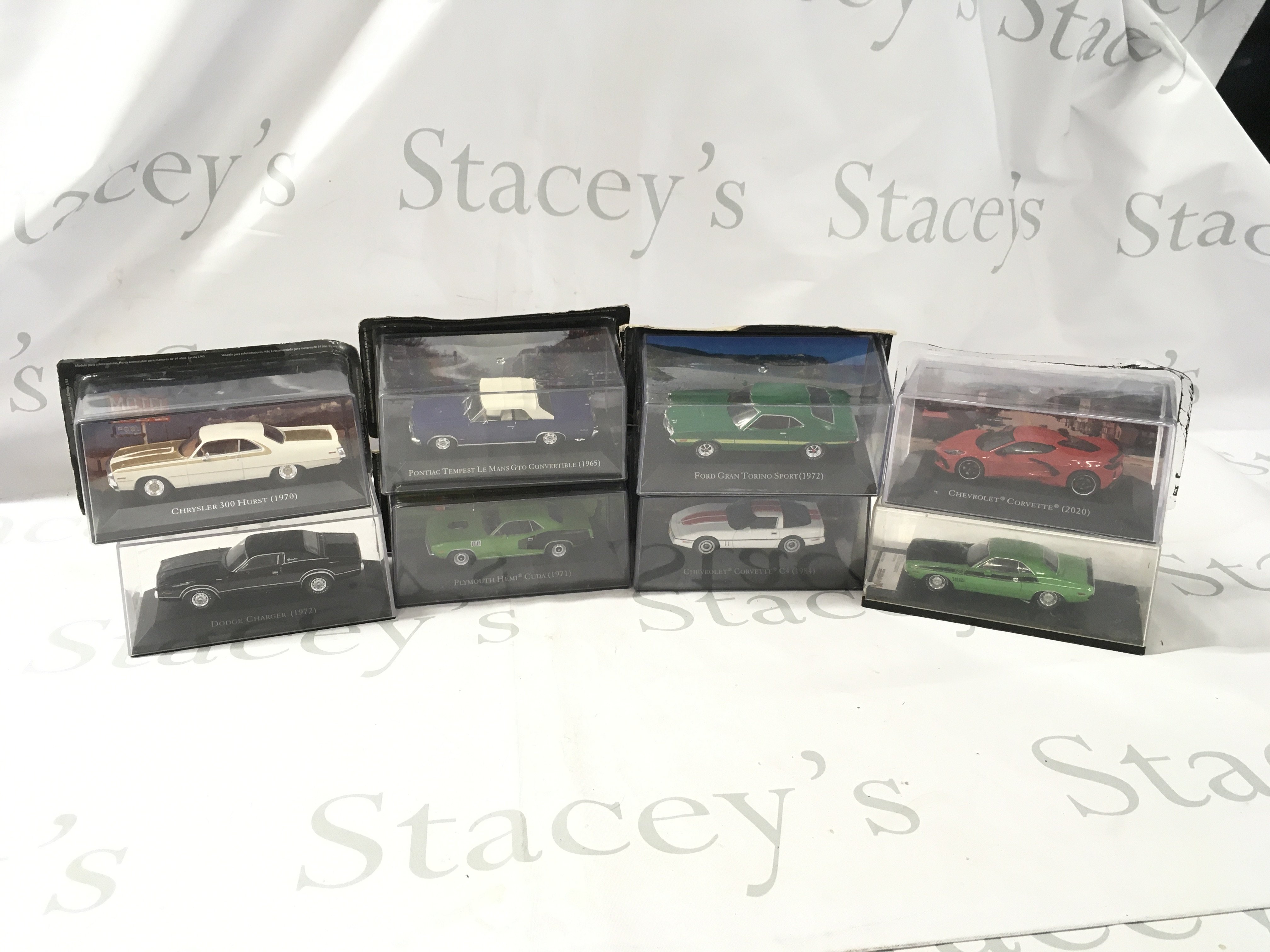 A collection of mostly unopened boxed diecast model cars by various manufacturers featuring American cars. No reserve.