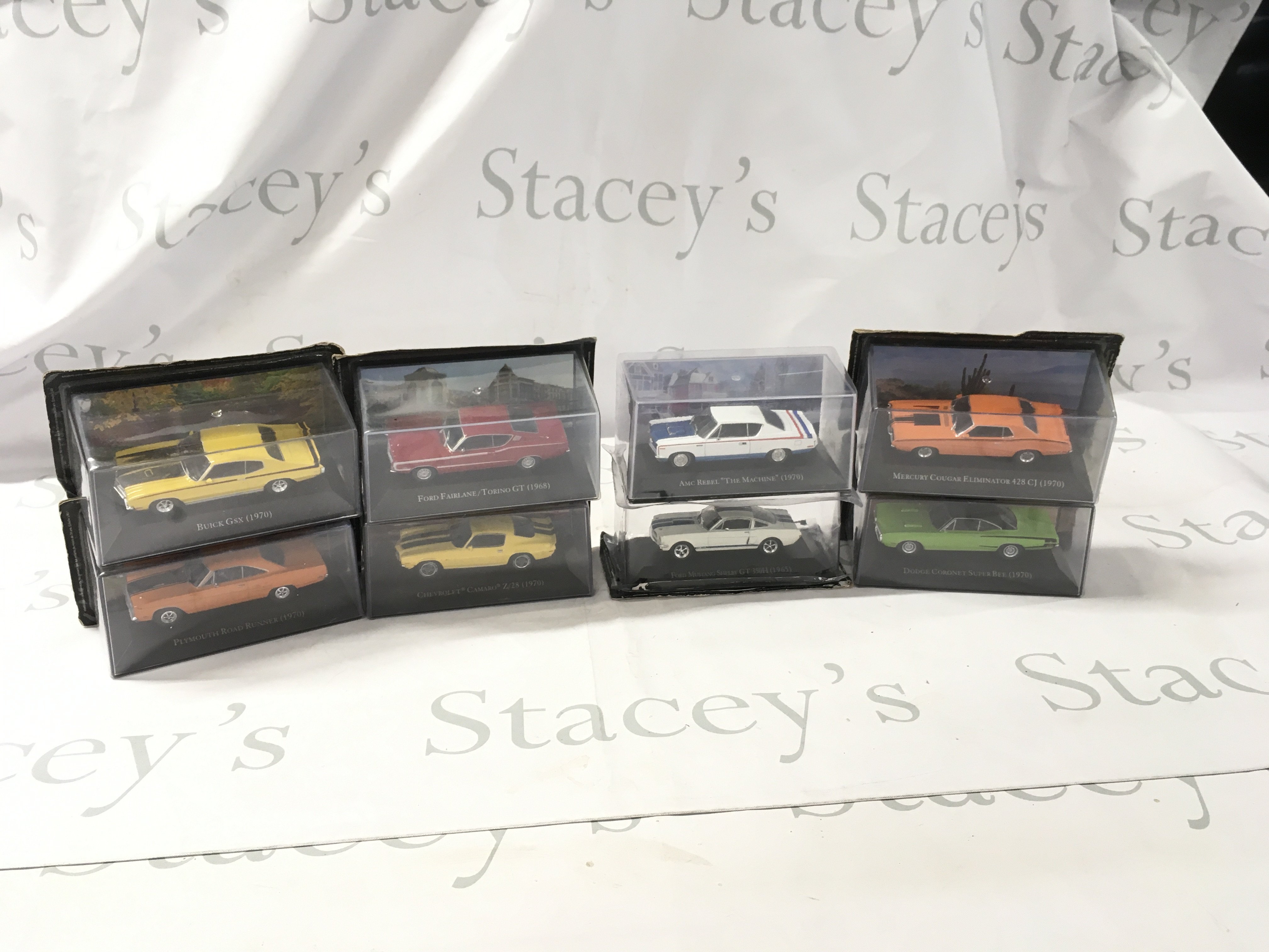 A collection of mostly unopened boxed diecast model cars by various manufacturers featuring American cars. No reserve