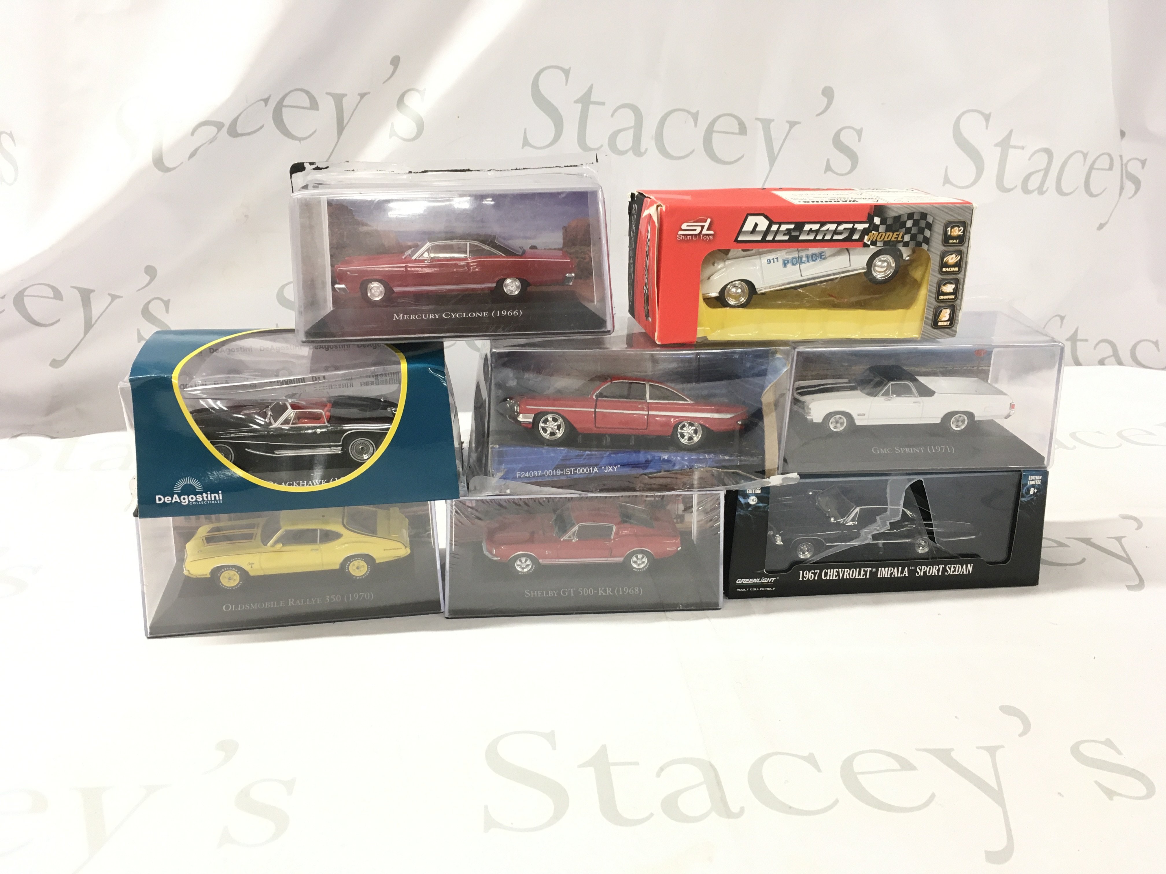 A collection of boxed diecast model vehicles by various manufacturers featuring American cars. No reserve