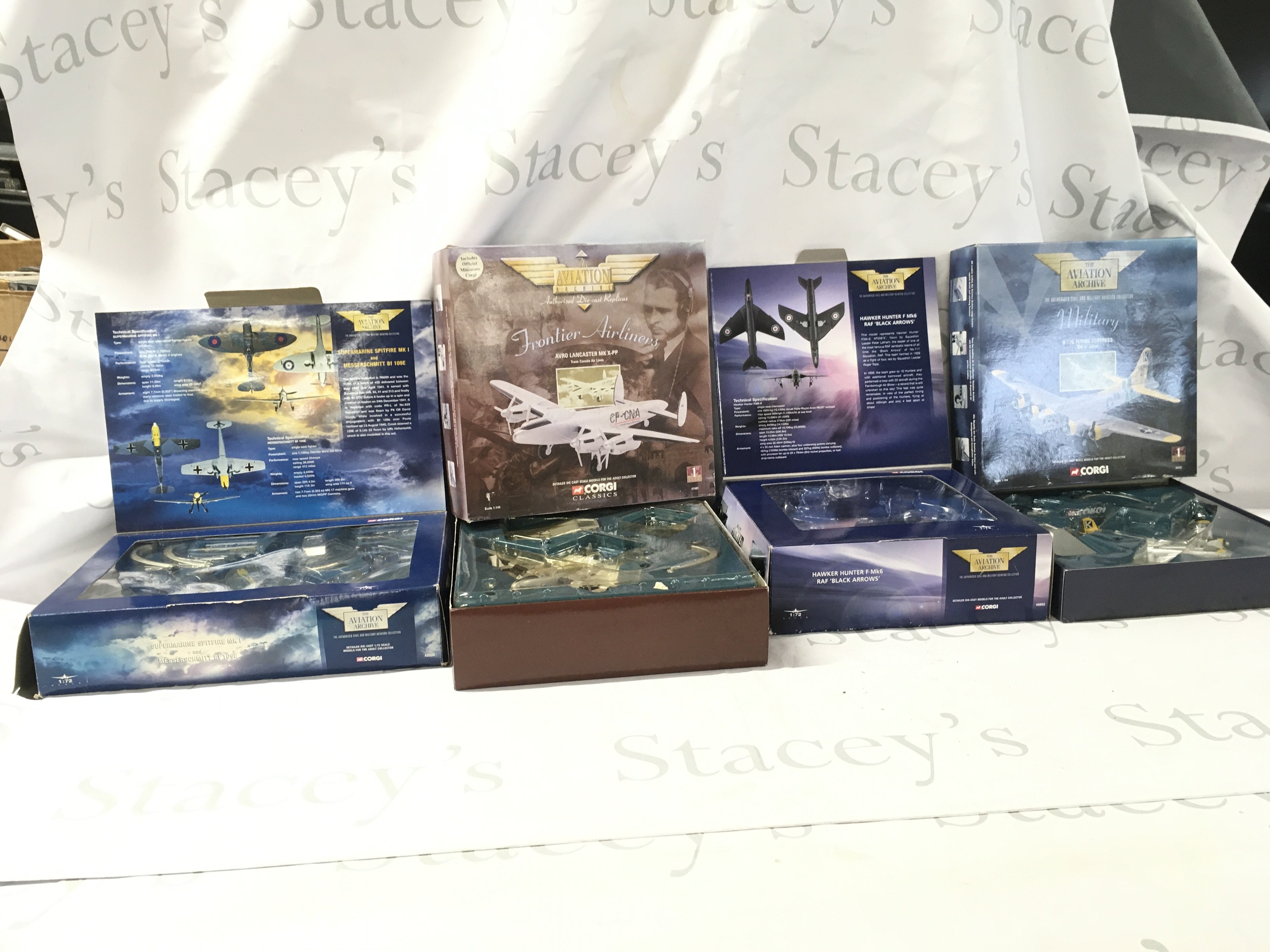 A collection of four boxed Corgi Aviation Archive model aircraft featuring 49505 Spitfire and Messerschmitt 109&hellip;. 49802 Hawker Hunter&hellip;48201 Flying Fortress&hellip;47401. Avro Lancaster. No reserve.