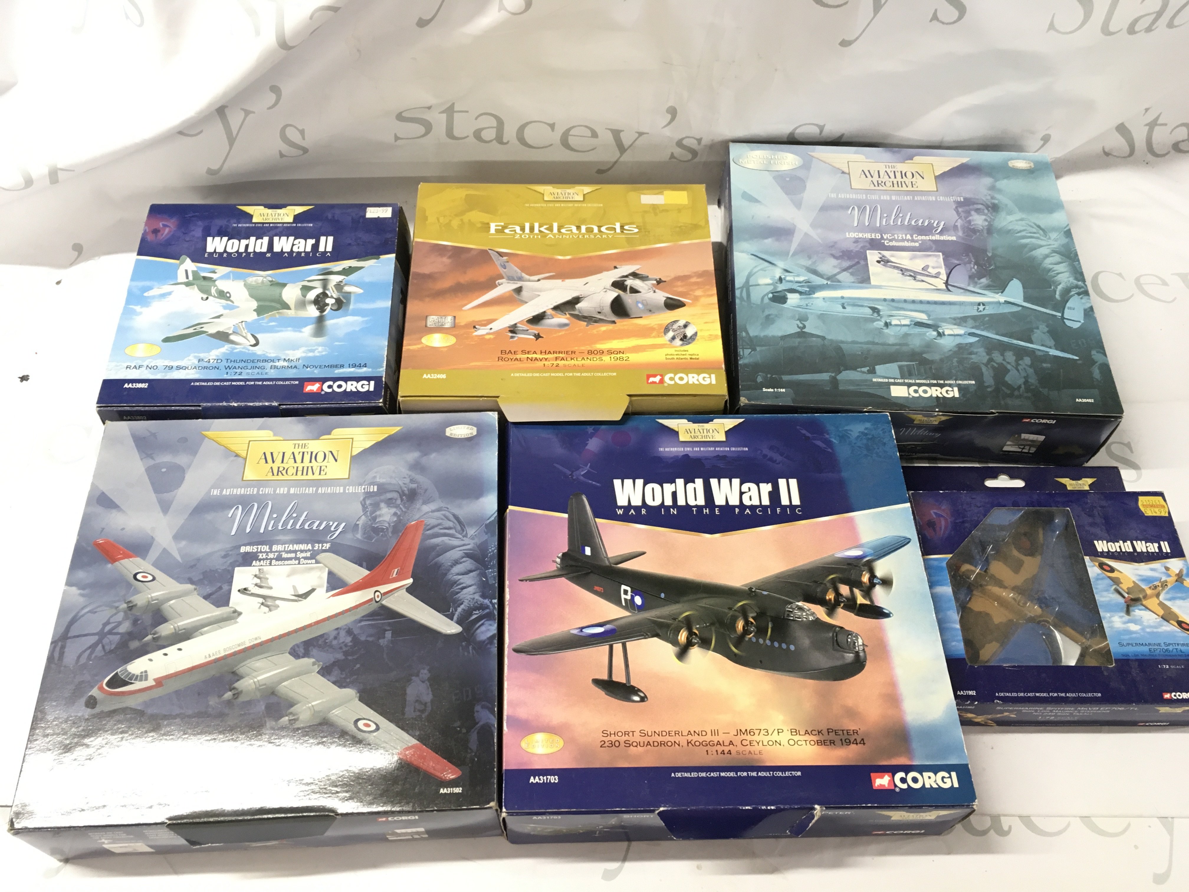 A Collection of Boxed Corgi Aviation Archive model planes including AA31703 Short Sunderland&hellip;.AA30402 Lockheed Constellation..AA32406 Sea Harrier&hellip;AA33802 Thunderbolt&hellip;AA31902 Spitfire&hellip;.AA31502 Bristol Britannia. No reserve