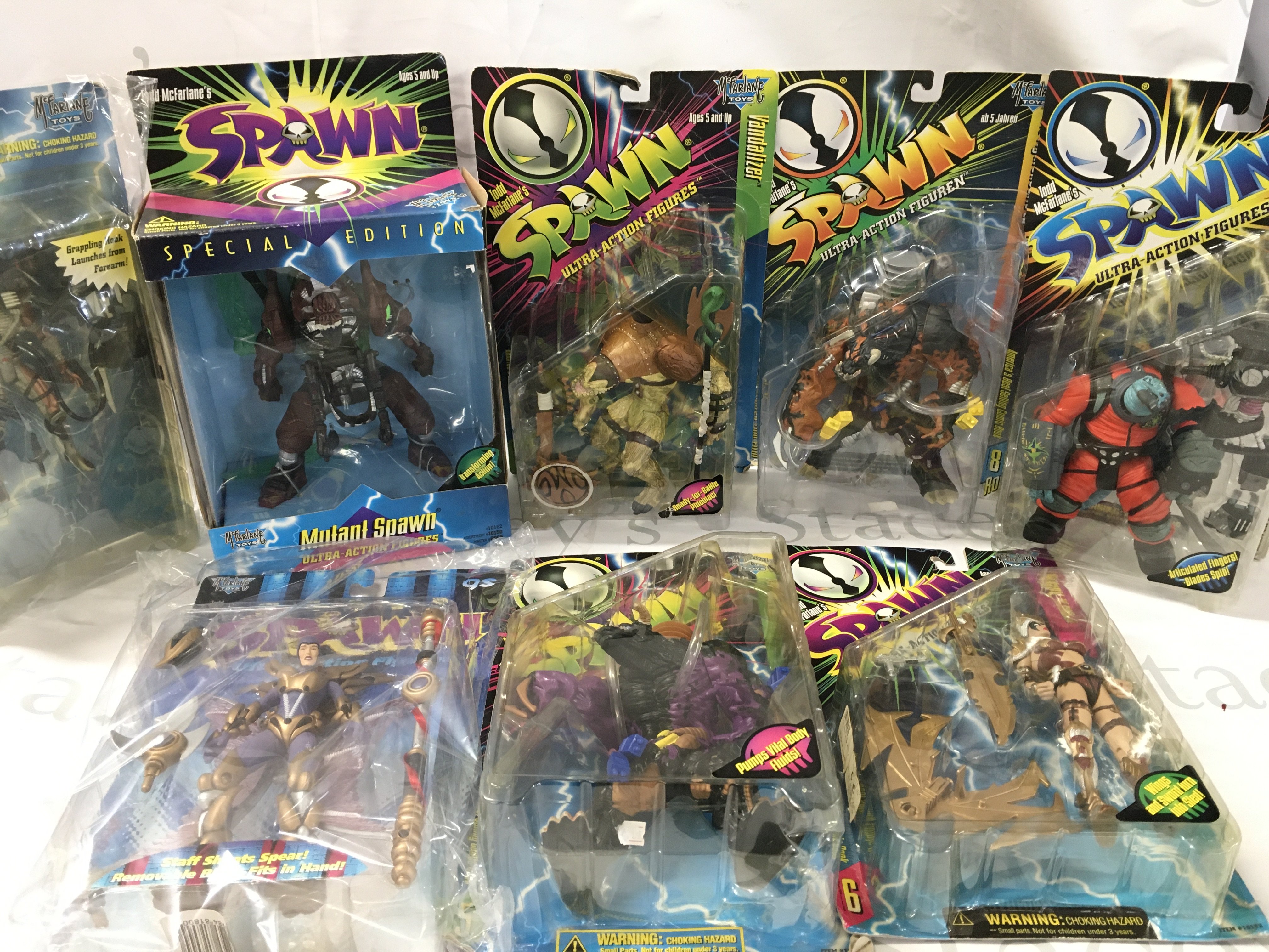 A Collection of 8 Carded Spawn Figures. No Reserve.