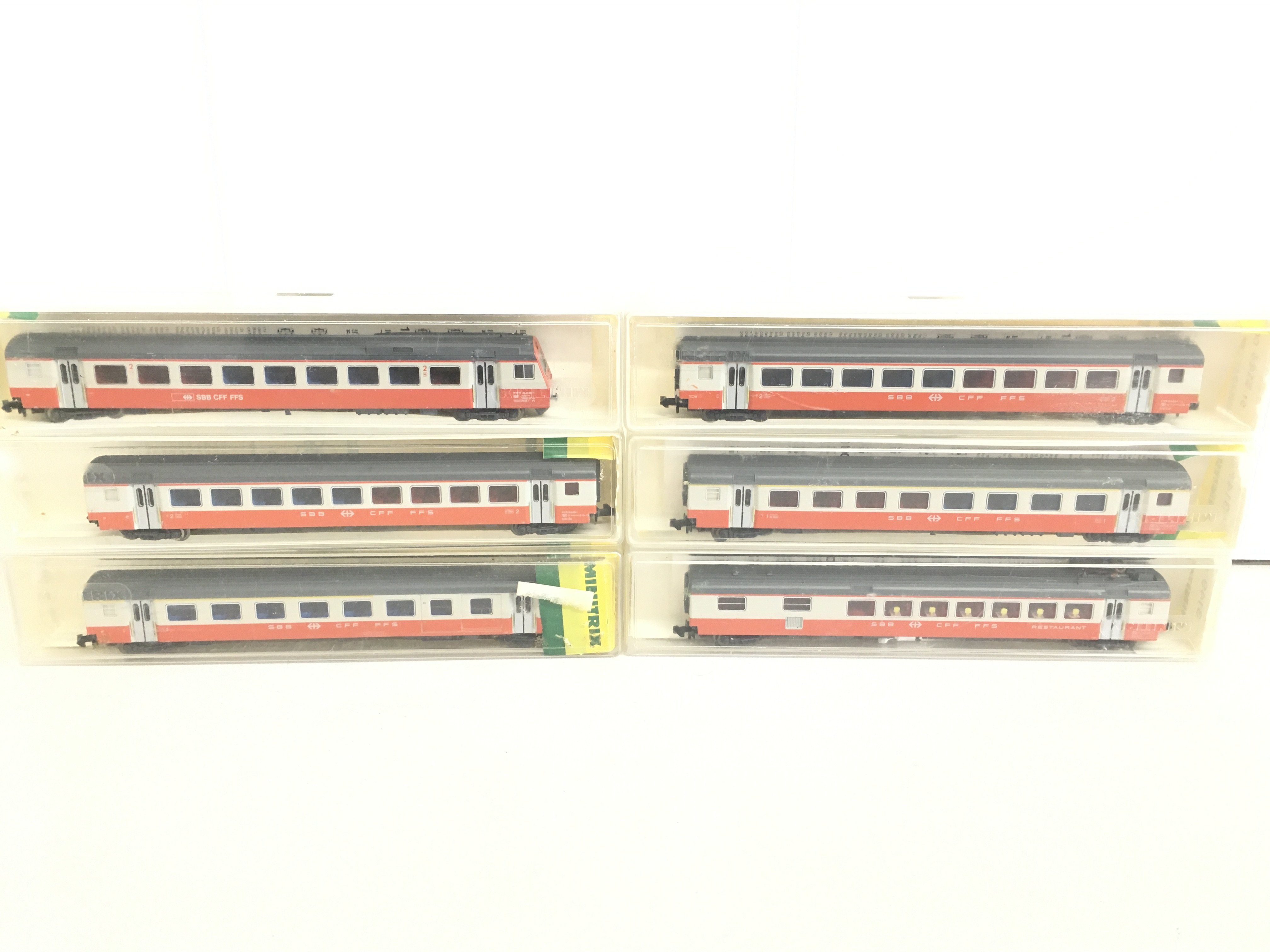 A Swiss Minitrix 6-Car Rake Of Einheistwagon III. includes Dummy Driving Trailer. Not In Original Boxes.