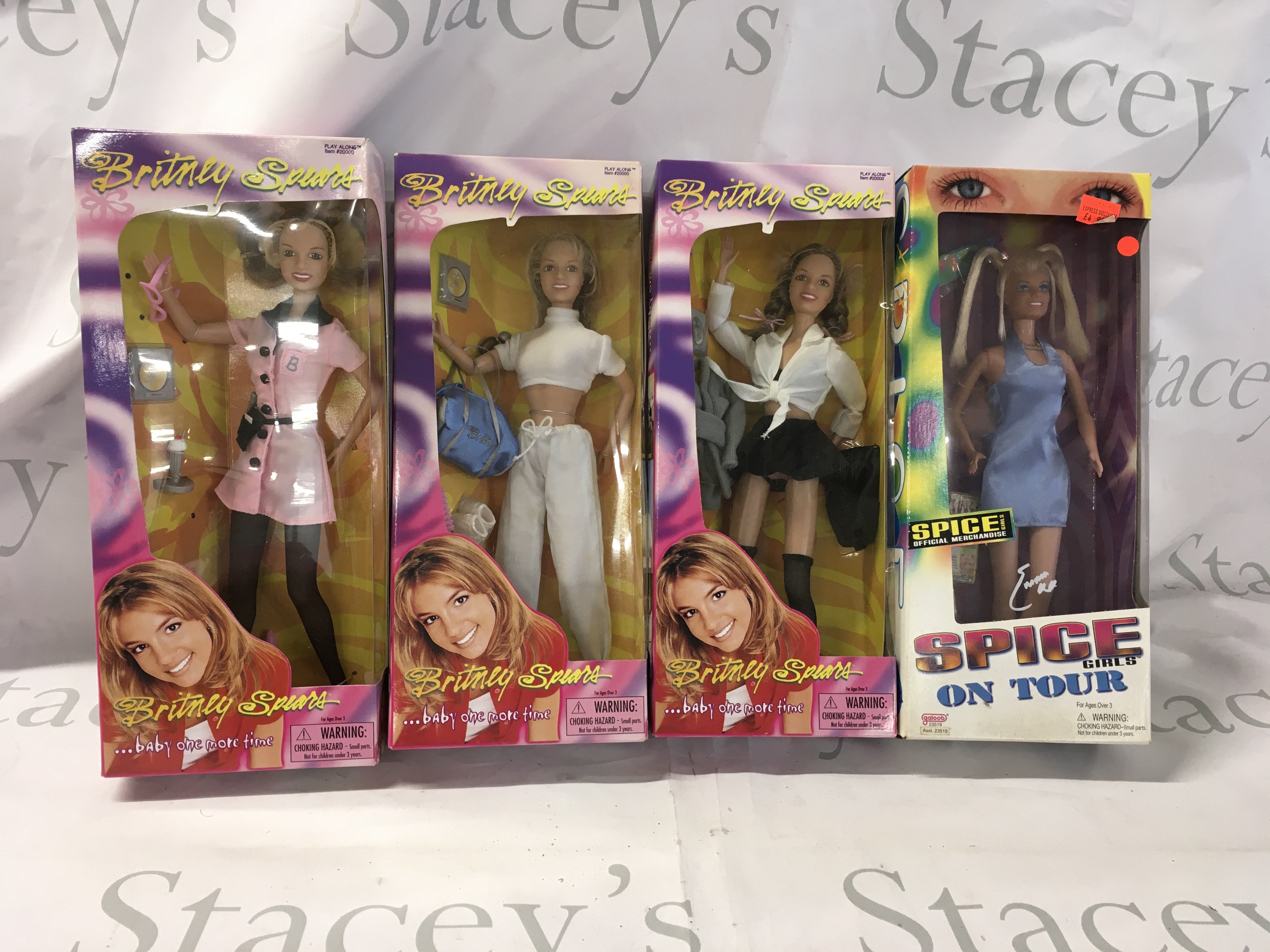 A collection of 4 boxed dolls, 3x Britney Spears and Emma Bunton Spice Girls on Tour. No reserve