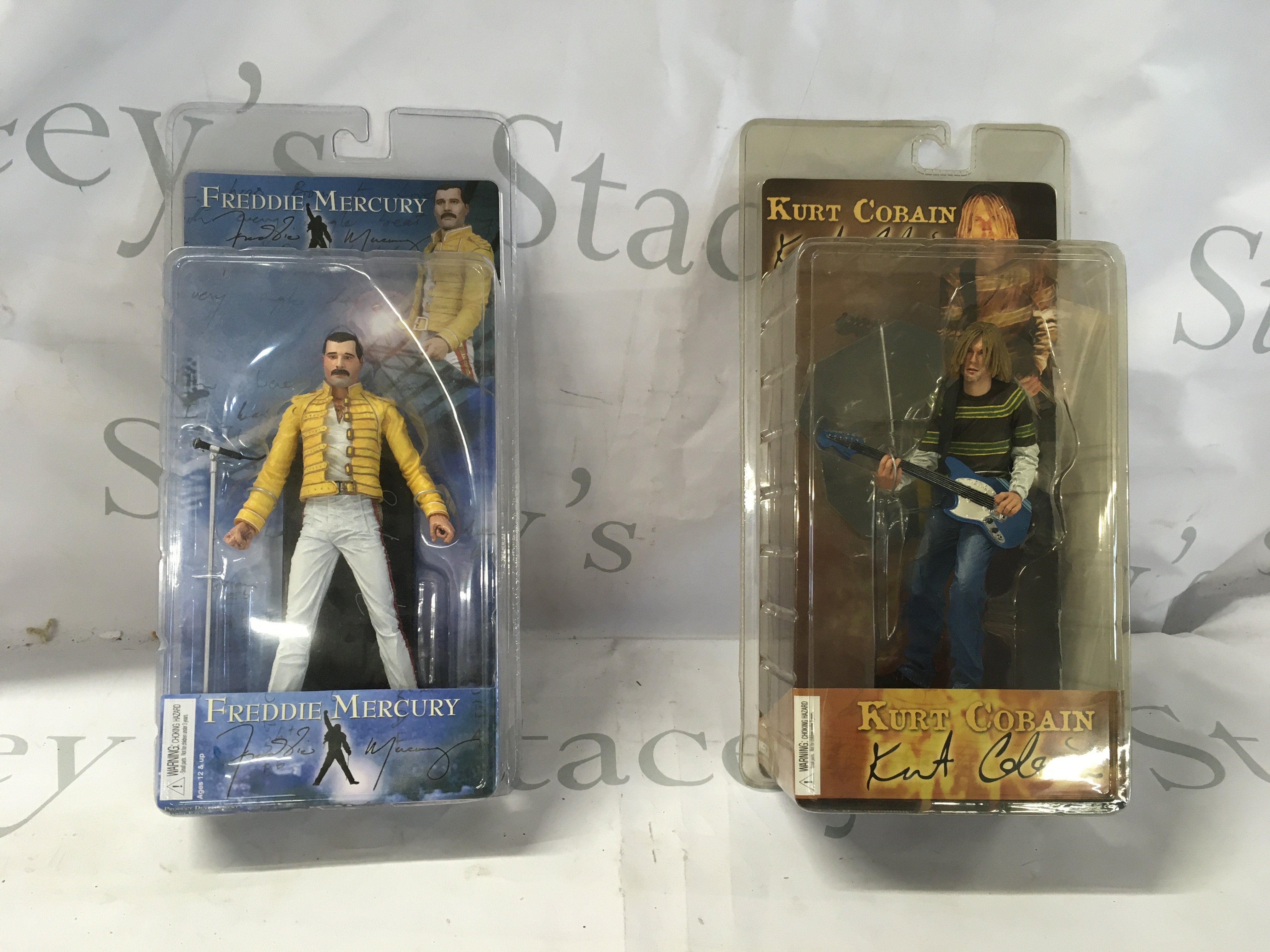 2x sealed action figures featuring Freddie Mercury and Kurt Cobain. No reserve