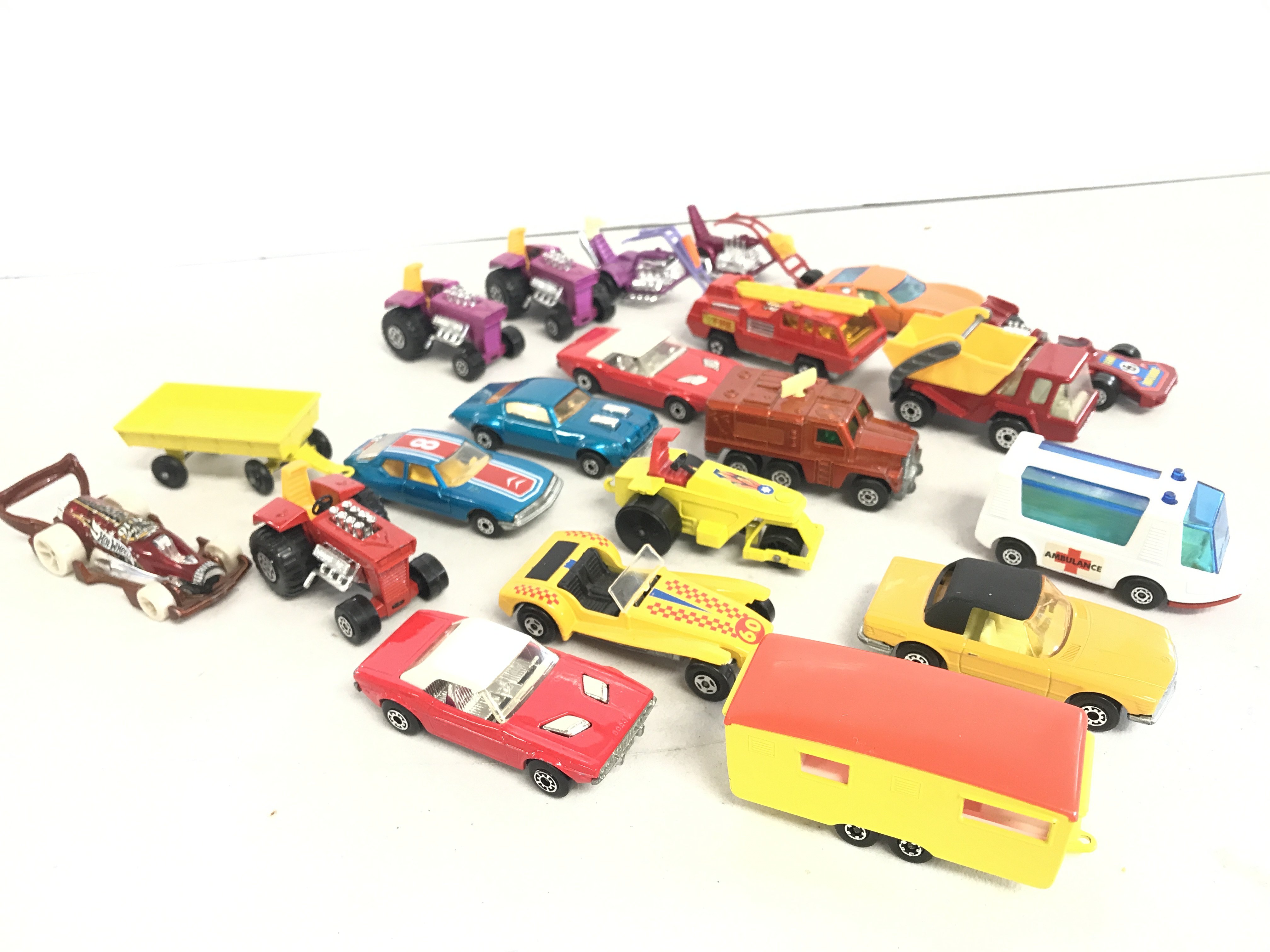 A Collection of 21 Matchbox 1-75 Series. Including 12 Superfast Models And A Rare Orange And Yellow Trailer Caravan.